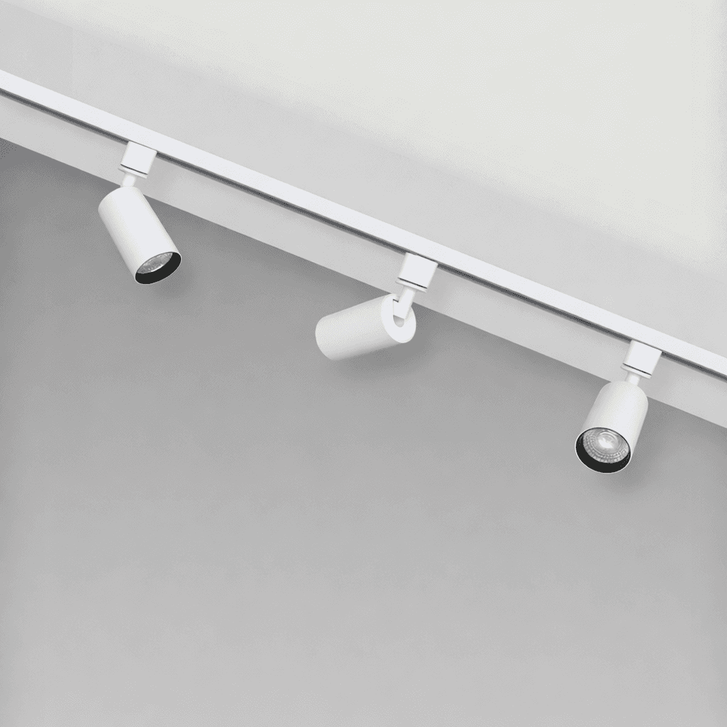 A young woman in jeans leans on a stool