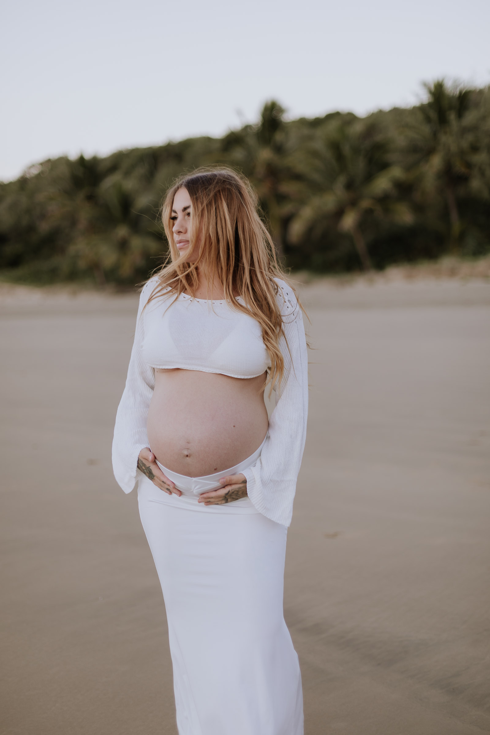 Maternity photo of pregnant mother at the beach in Mackay QLD