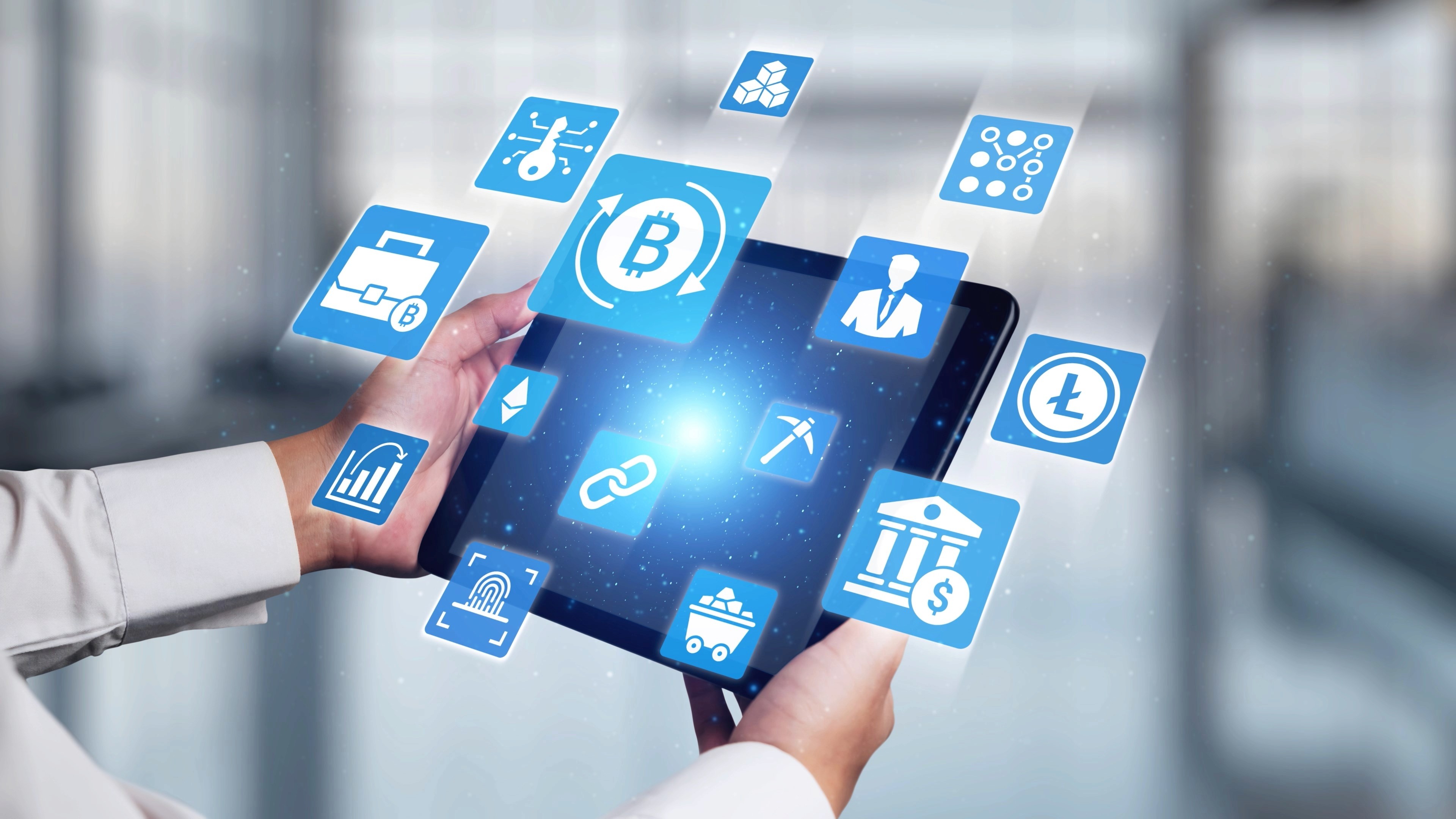 Spacious open-plan office with rows of desks and striking circular ceiling lights.