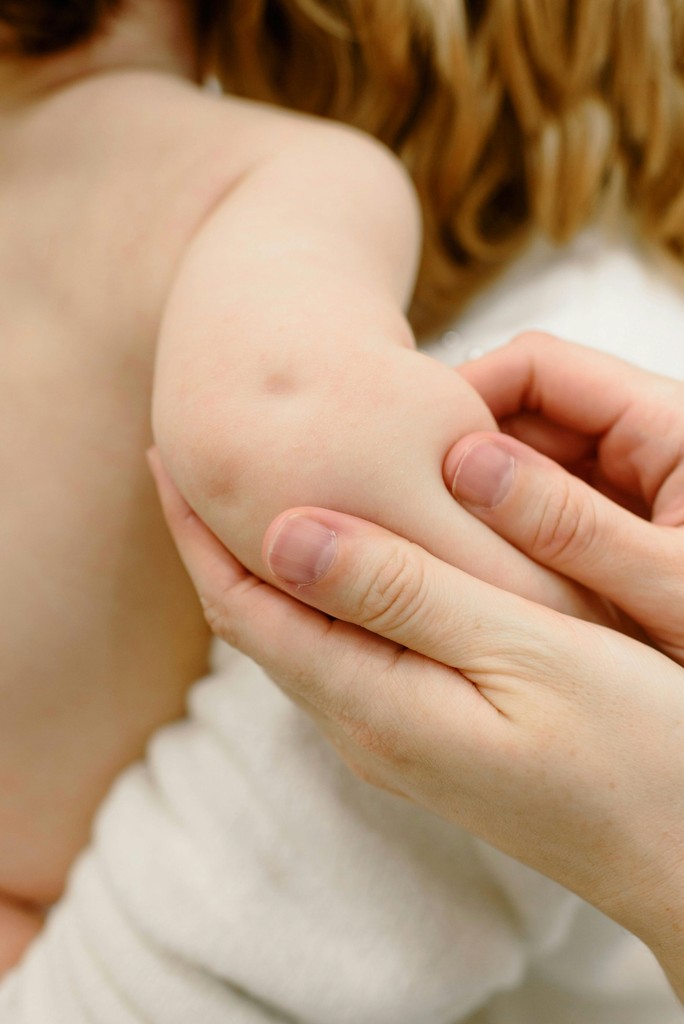 persons hand on persons lap