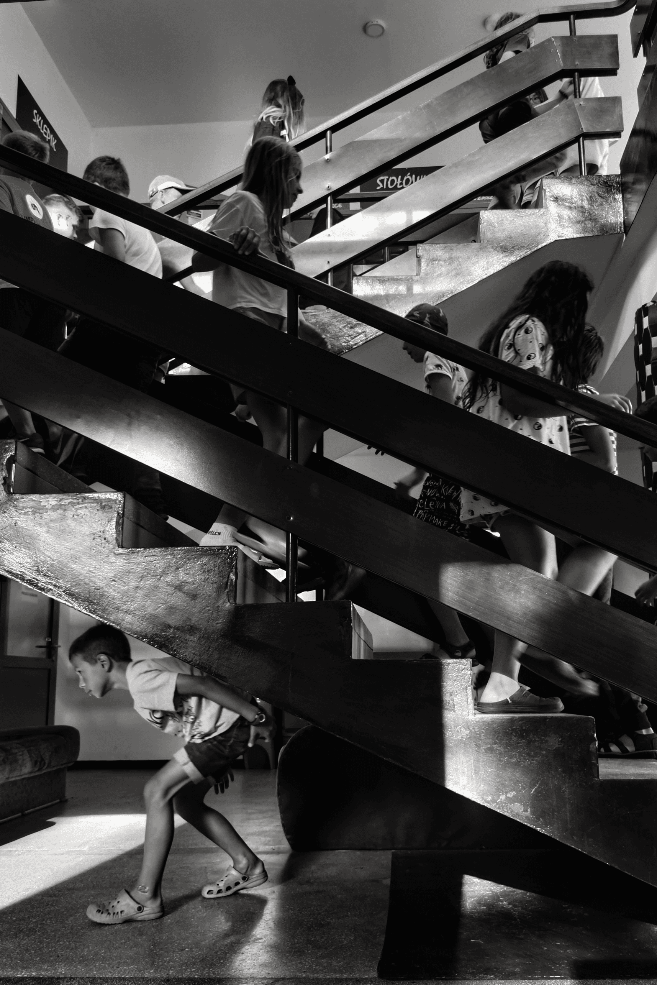 Two people talking on a rooftop at sunset