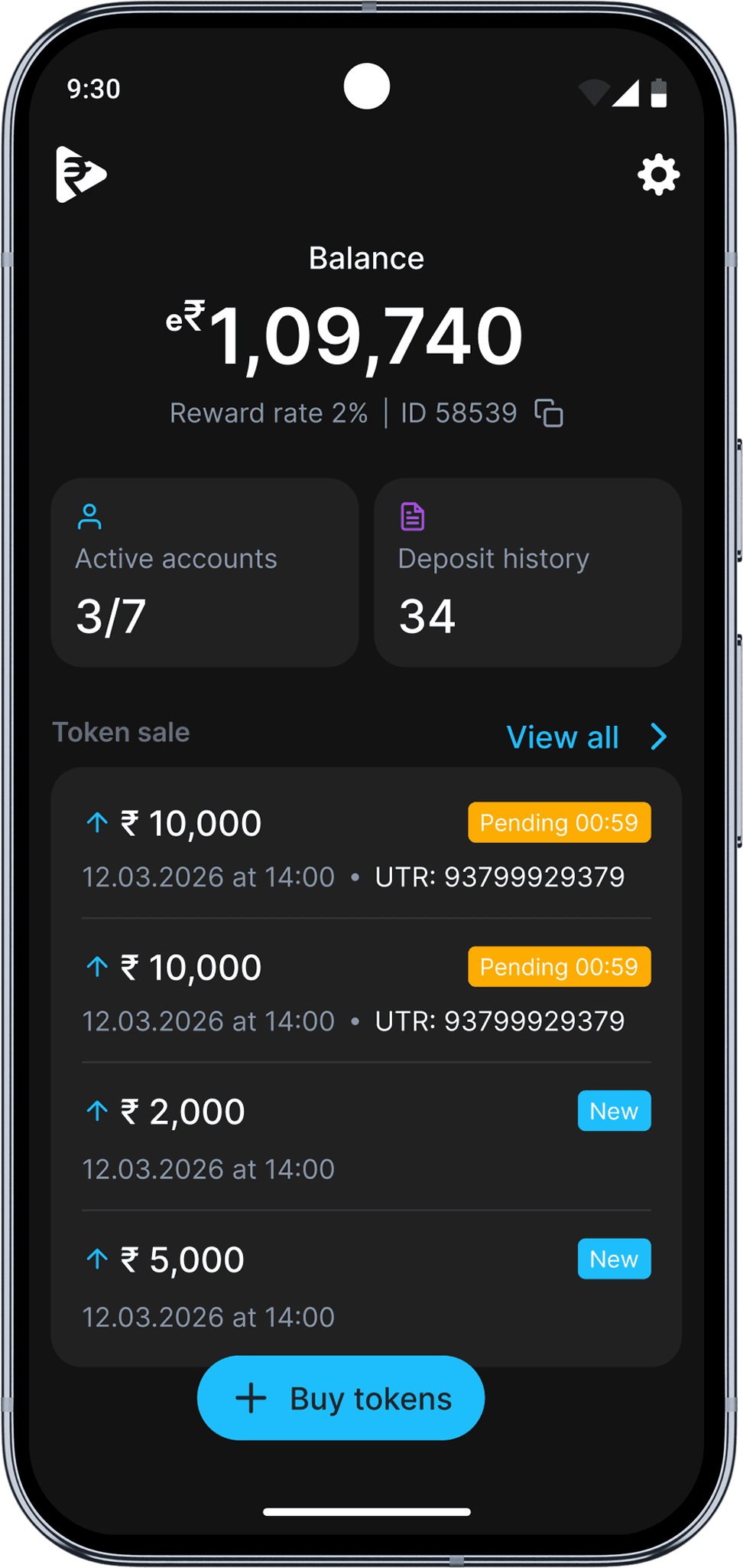 Happy woman in a green sweater holding a phone and looking up