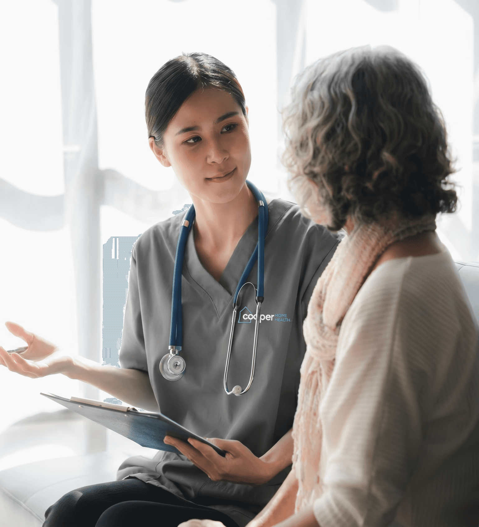 Nurse speaking with patient.
