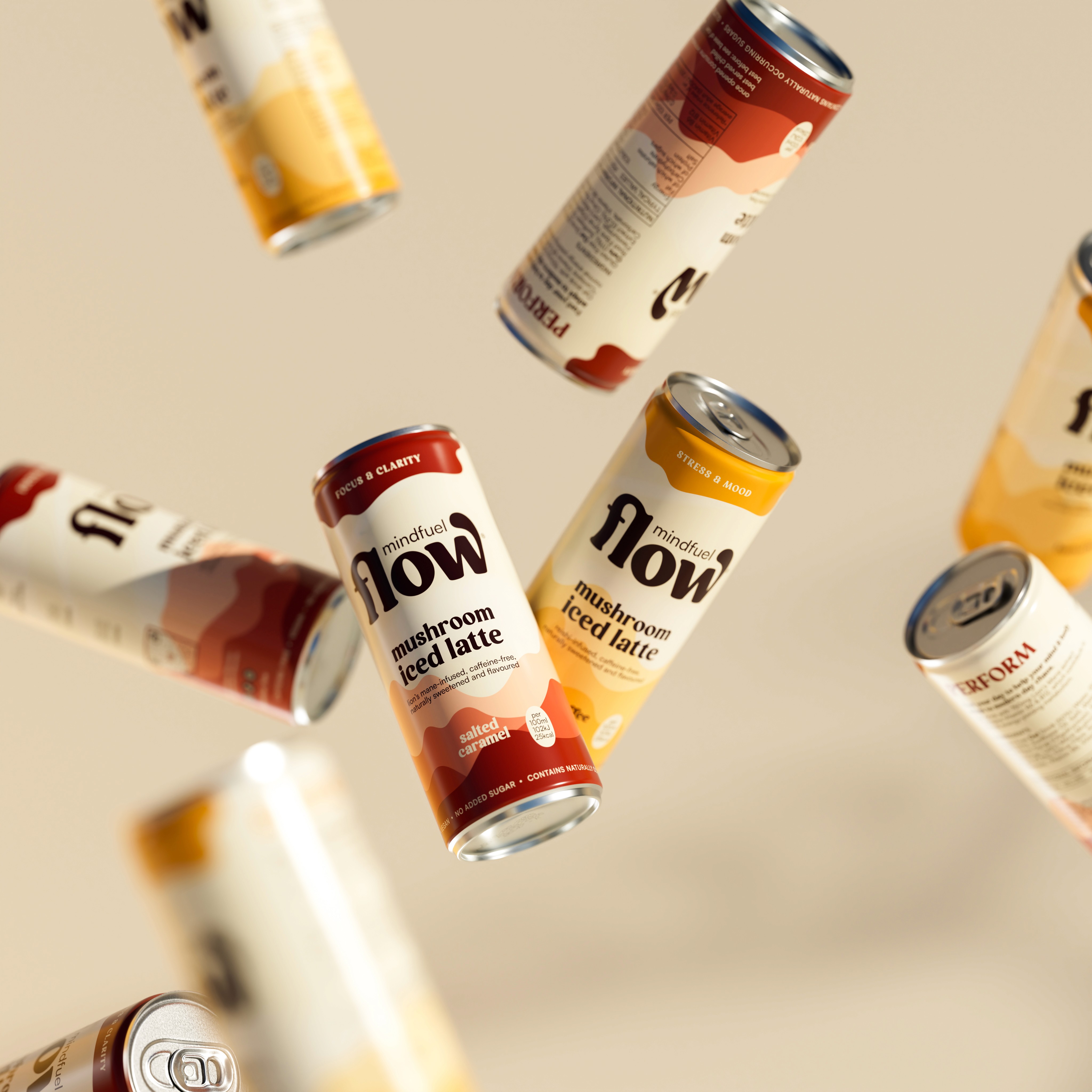 A young person with curly hair smiles at the camera while sitting in front of a laptop against a dark background.