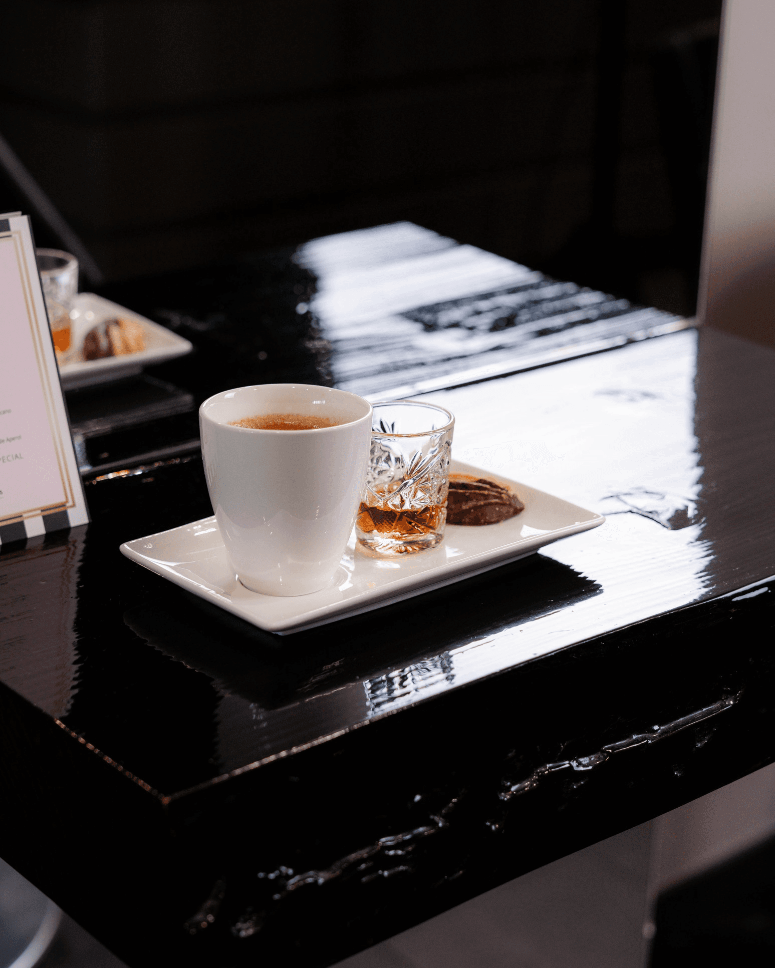 woman in brown long-sleeved top standing beside wall