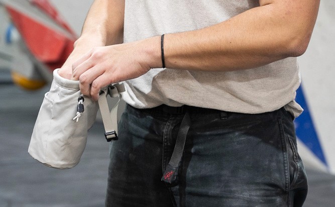 bouldering man chalking up