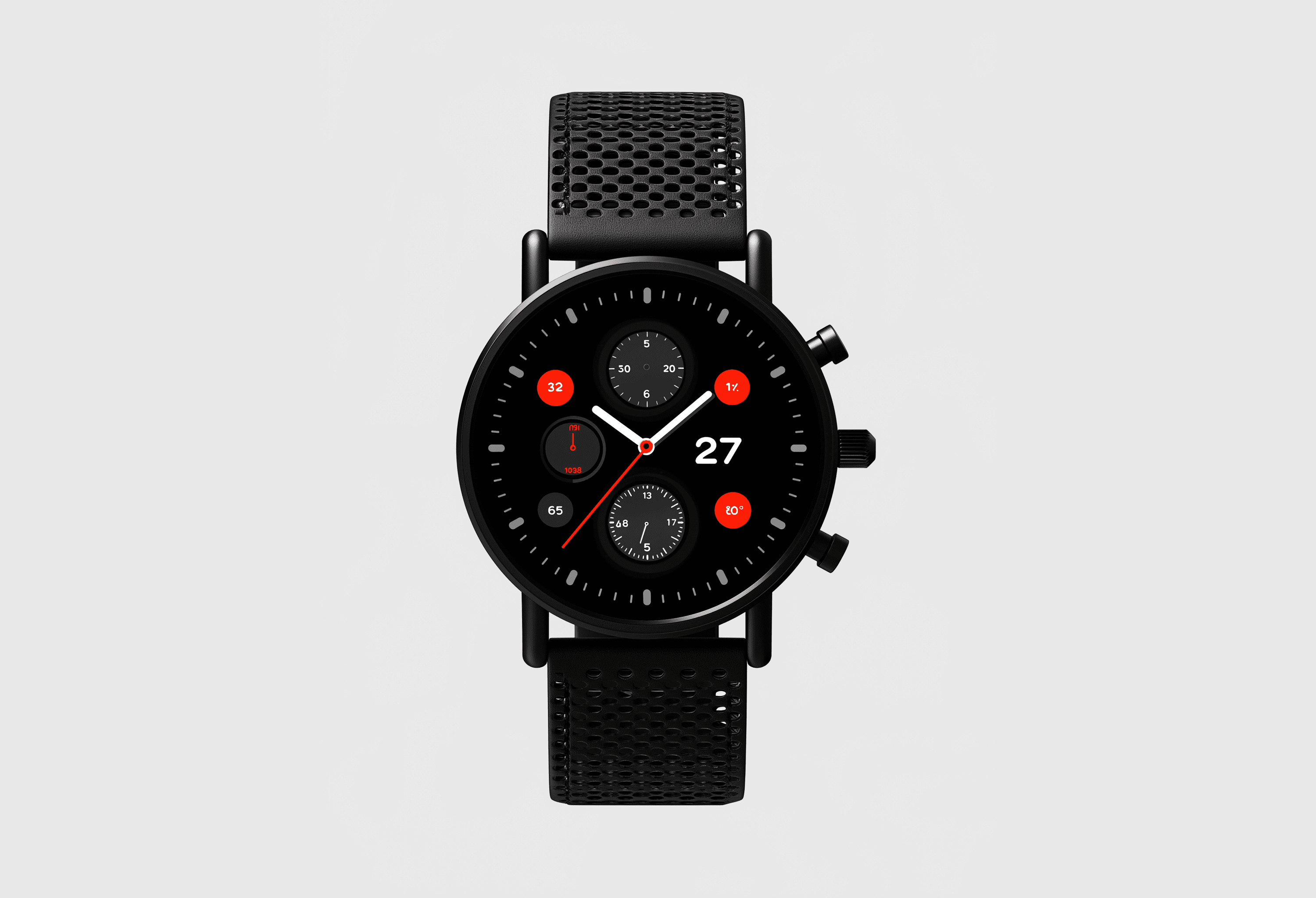 A front-facing studio shot of a black chronograph watch with a black mesh strap against a plain light gray background.