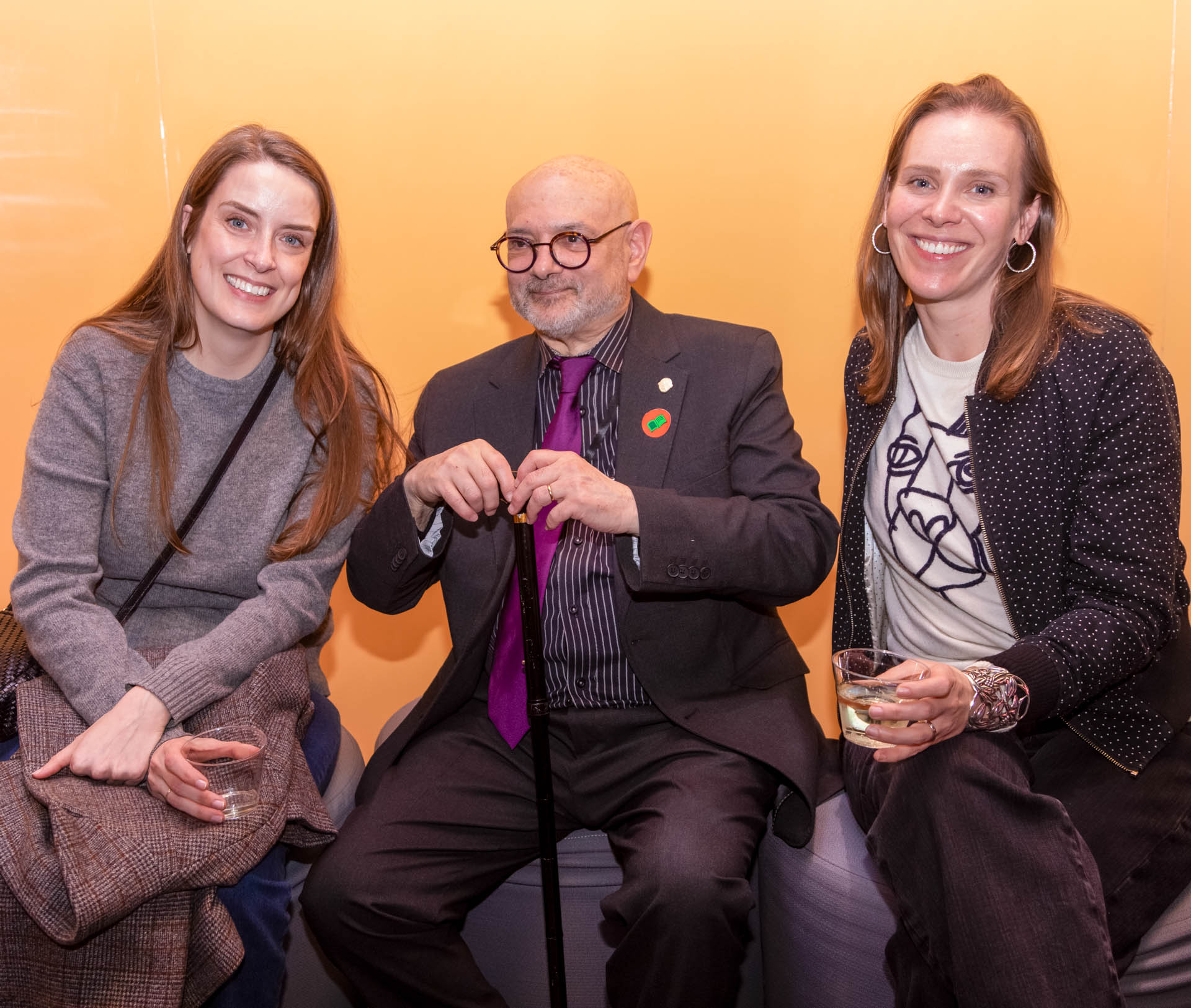 a group of students smiling for the camera in the SVA Theatre lobby after the Venture Forum