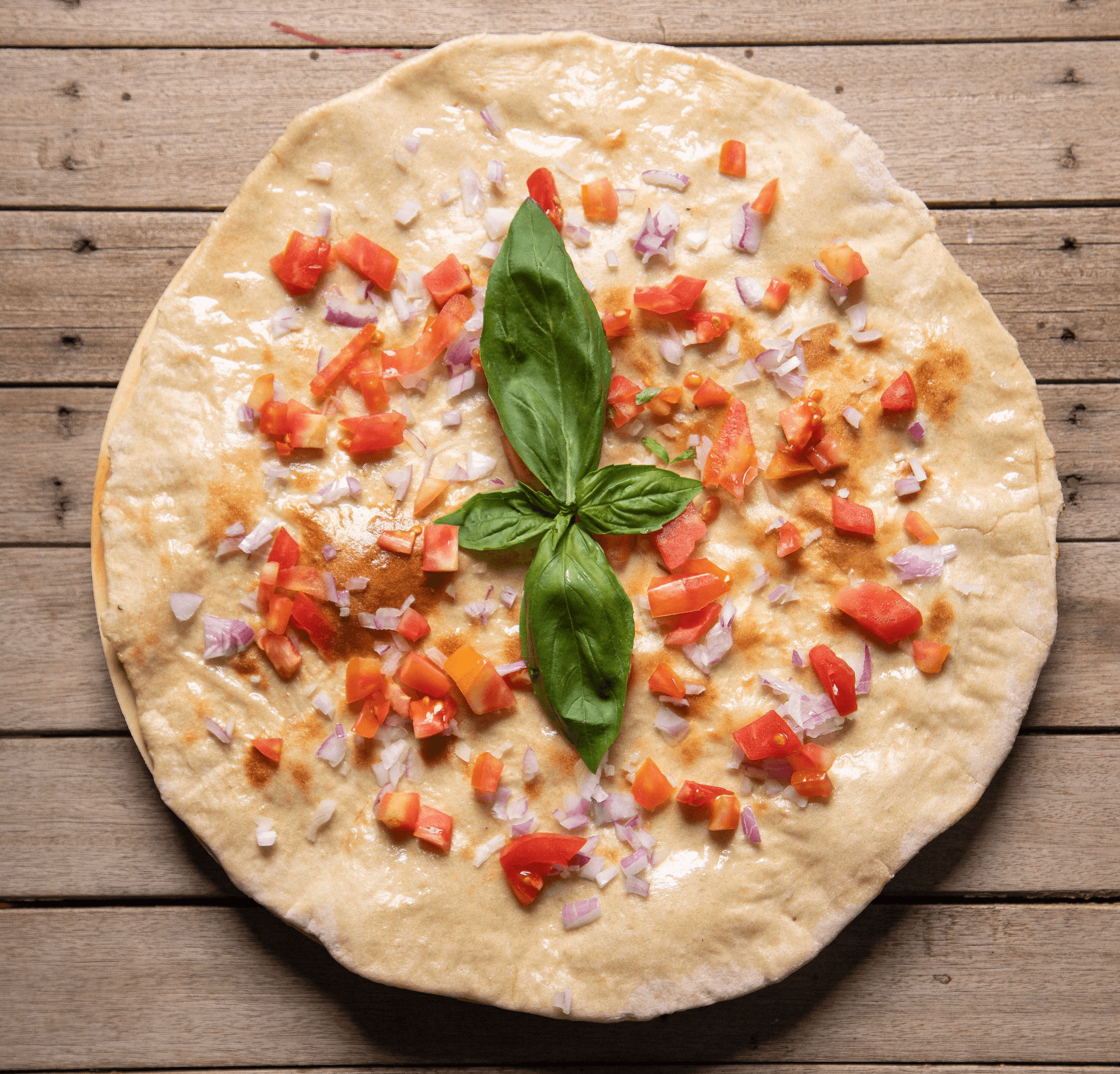 Home made focaccia with tomato cubes and onion