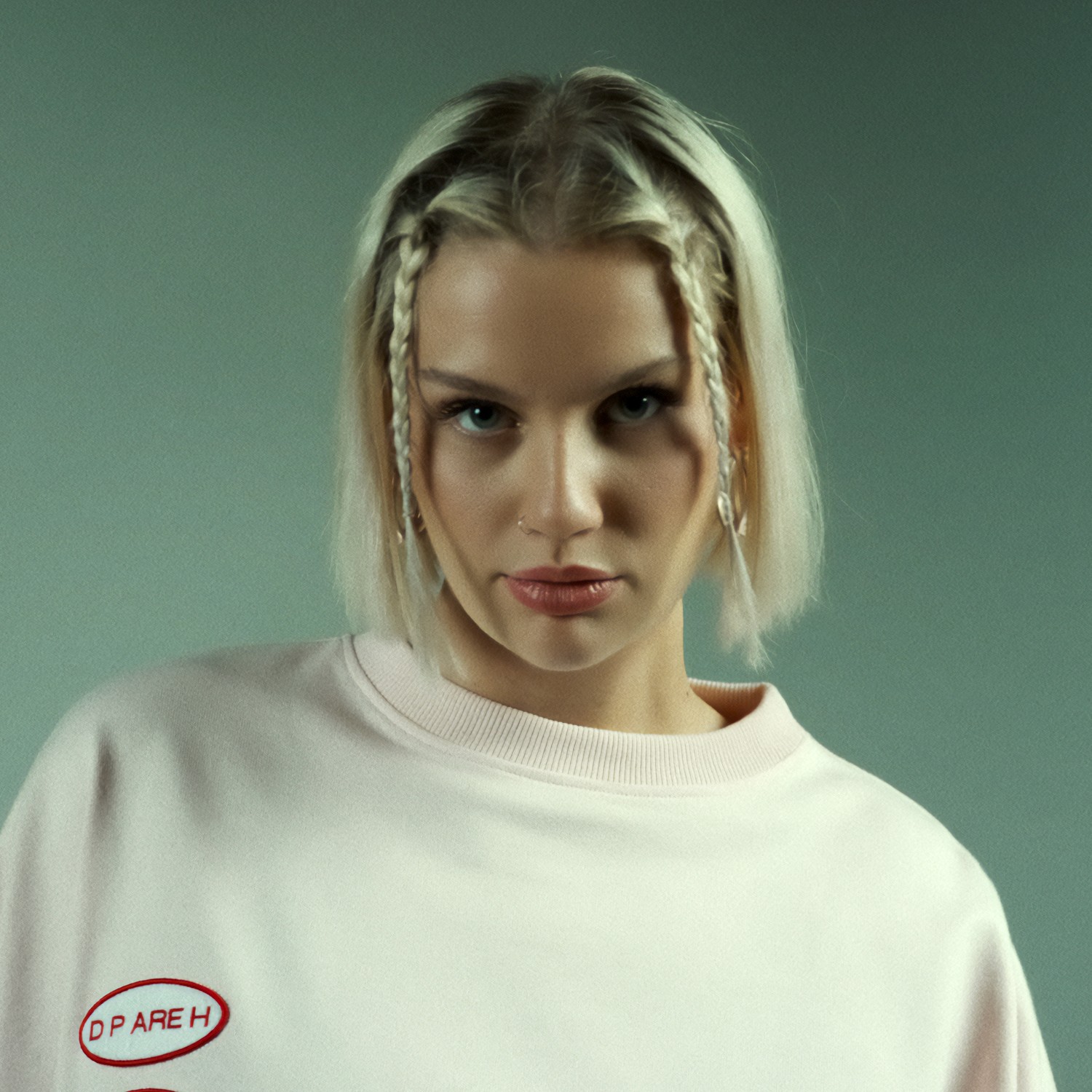 portrait of a model female in a studio, leica q2, 28mm, color grading cinematic look