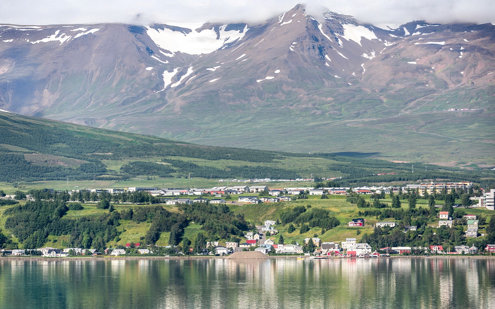 Akureyri cityscape with mountains across Eyjafjordur, Iceland.