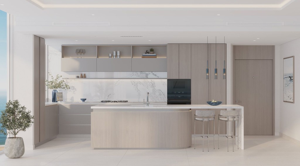 Contemporary kitchen  with expansive window overlooking the ocean at Ellington Sands, Dubai Islands.