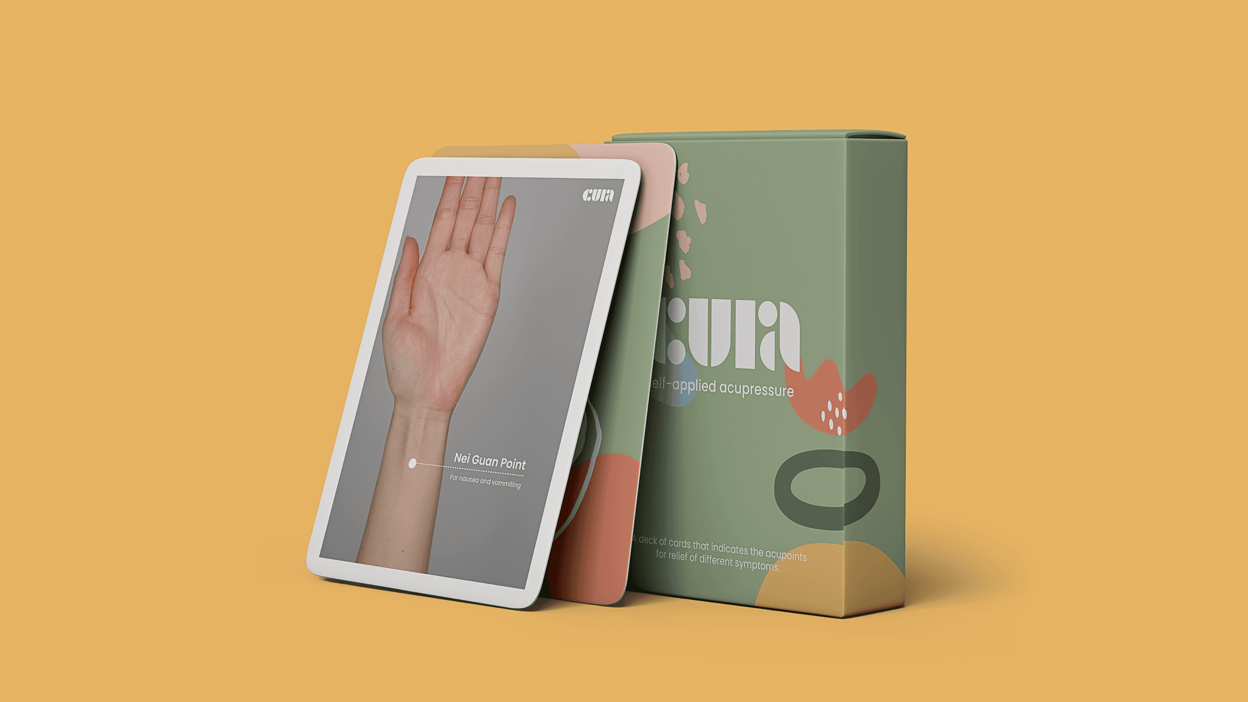 A tablet displaying a hand reaching upward is positioned next to a green box. The box features the text "CUR" in a stylized font, along with smaller text reading “self-applied acupressure” and “for relaxation and wellness.” The background is a solid yellow-orange color.