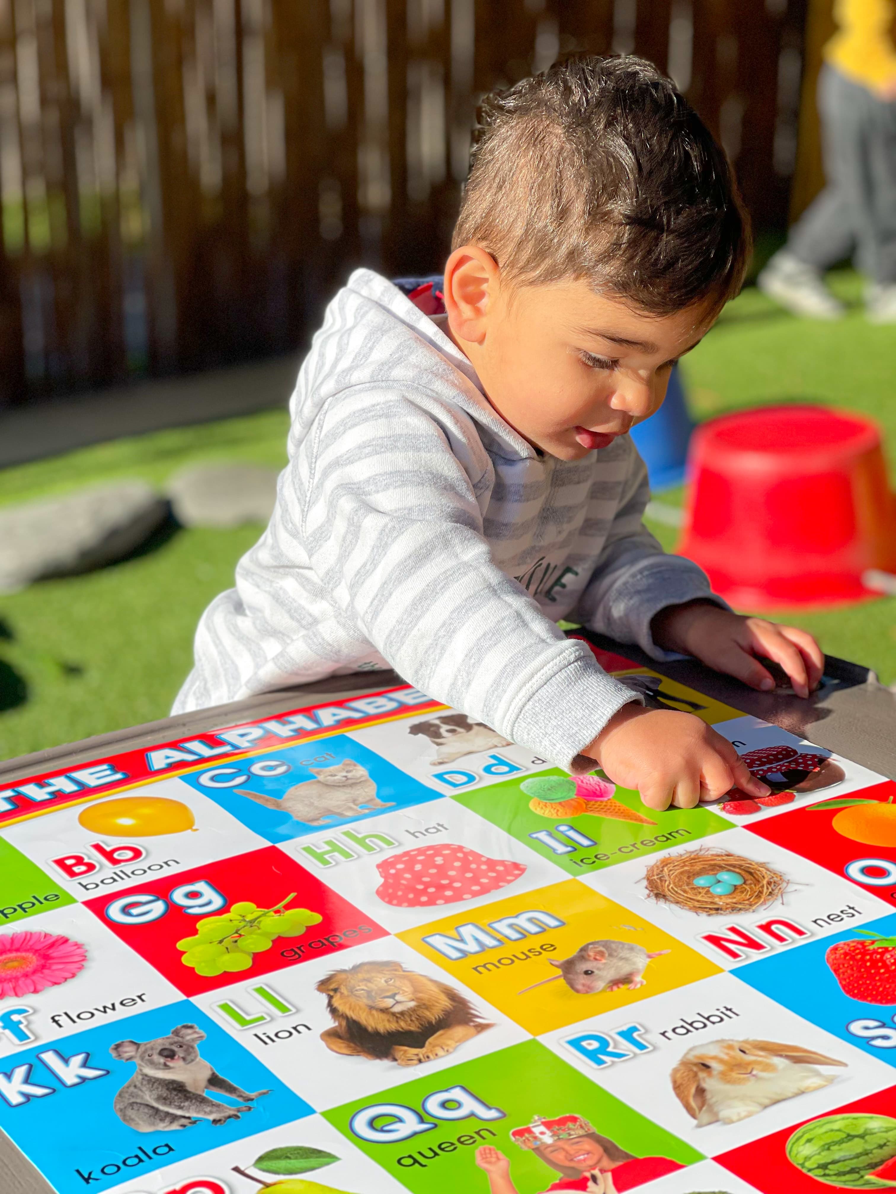 Image of child playing outside