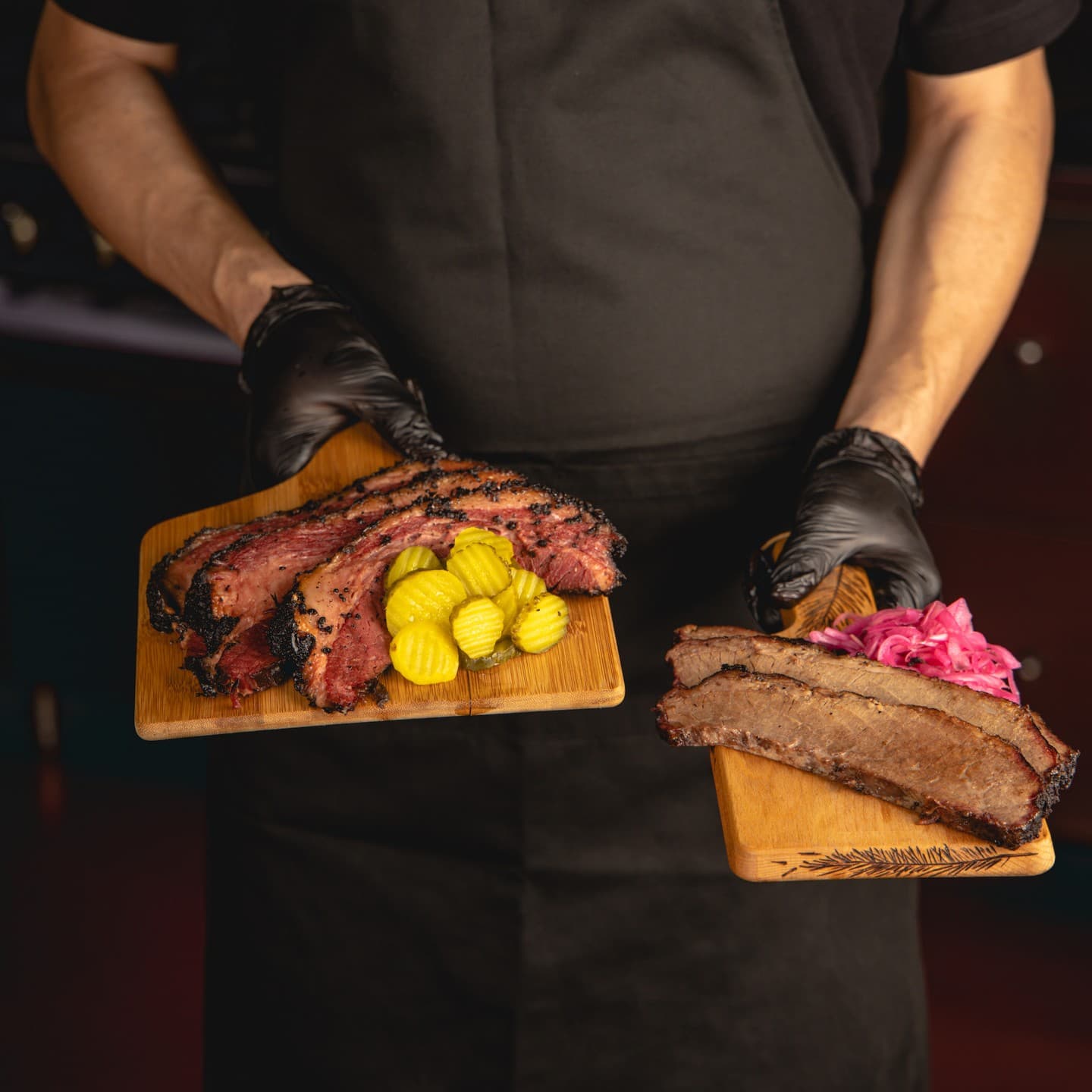 Texas BBQ on a wooden chopping board, showcasing its beautiful meat slices, ready to share, savour, and enjoy with friends.