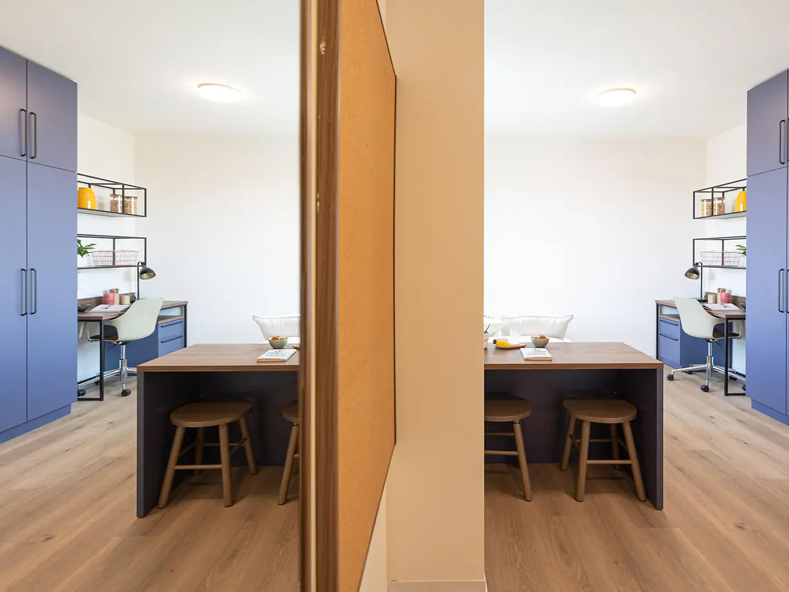 Study and desk area with breakfast-bar seating in Bologna student accommodation