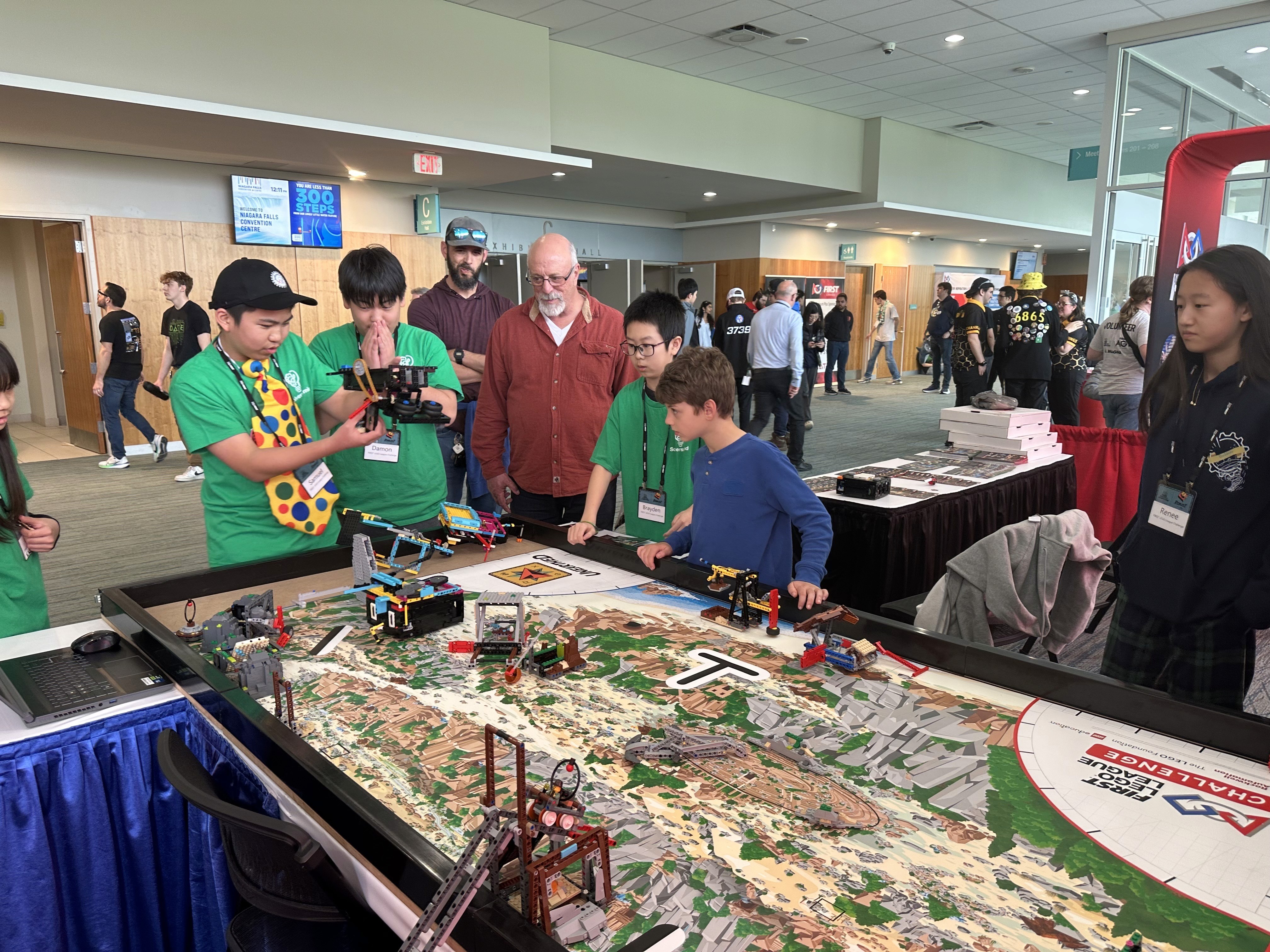 Solversmind Chrono Solvers FLL team showcases their robot to visitors at the Ontario FRC Championship