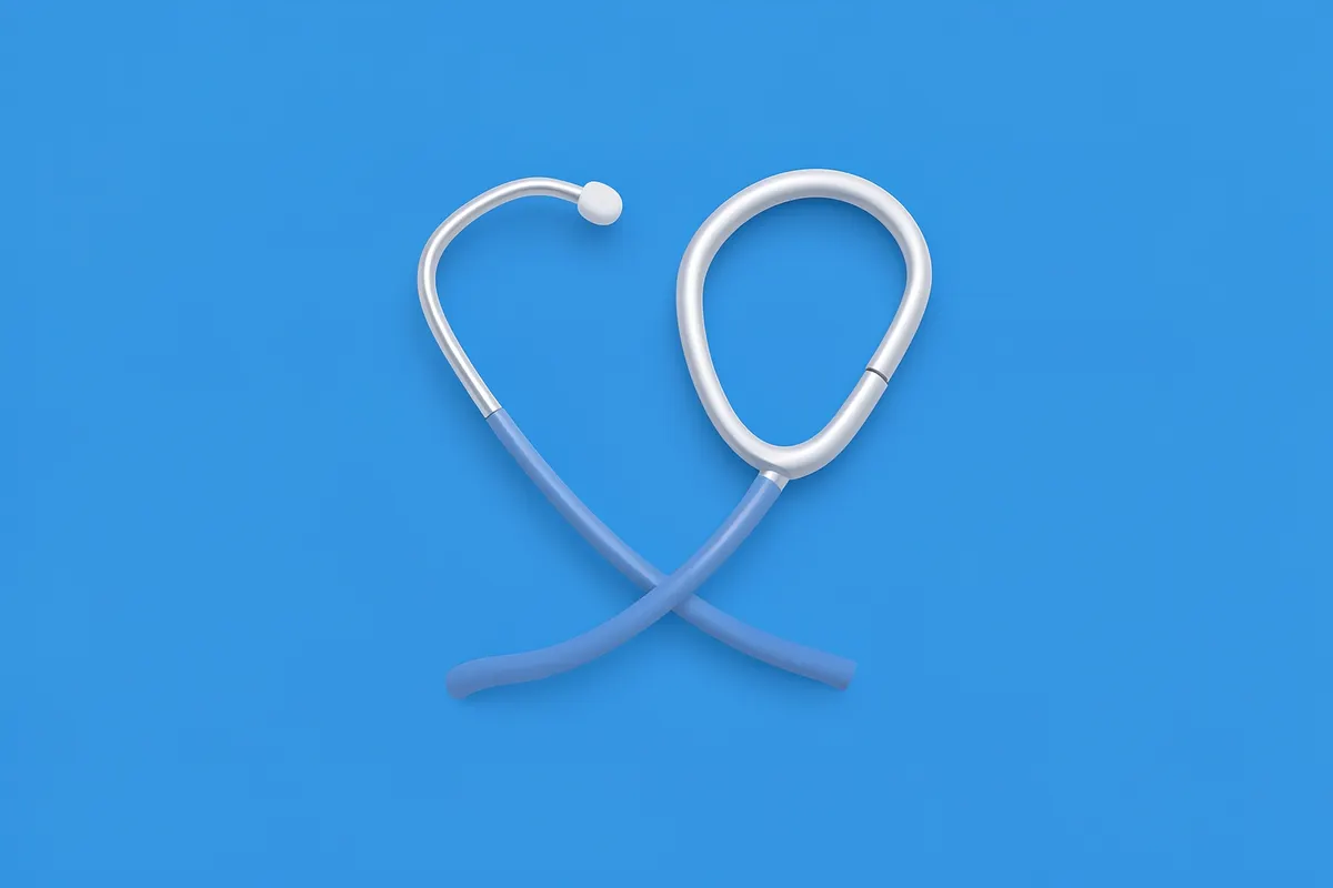 A stethoscope forming a heart shape on a blue background.