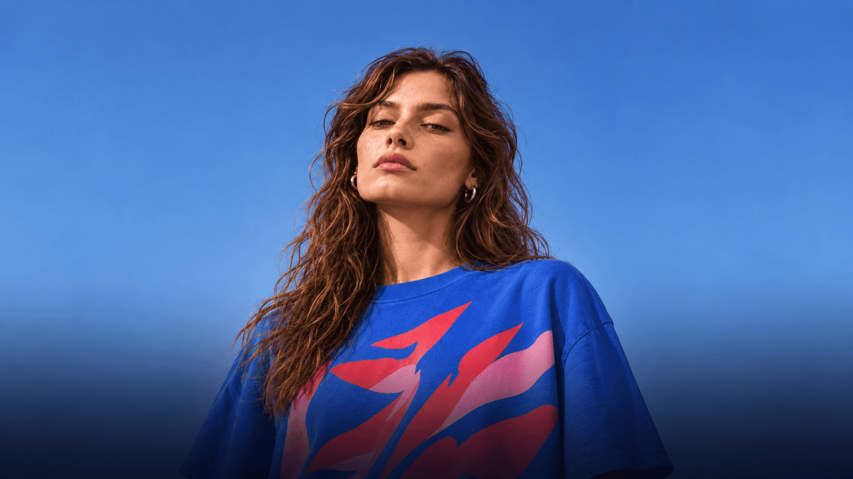 Portrait of Noa Rive against a deep blue sky