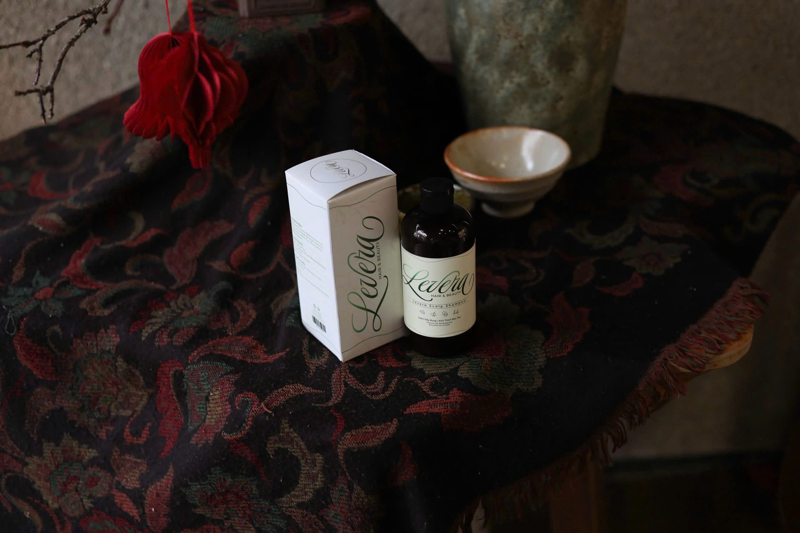 three bottles of makeup product mockup on a white background