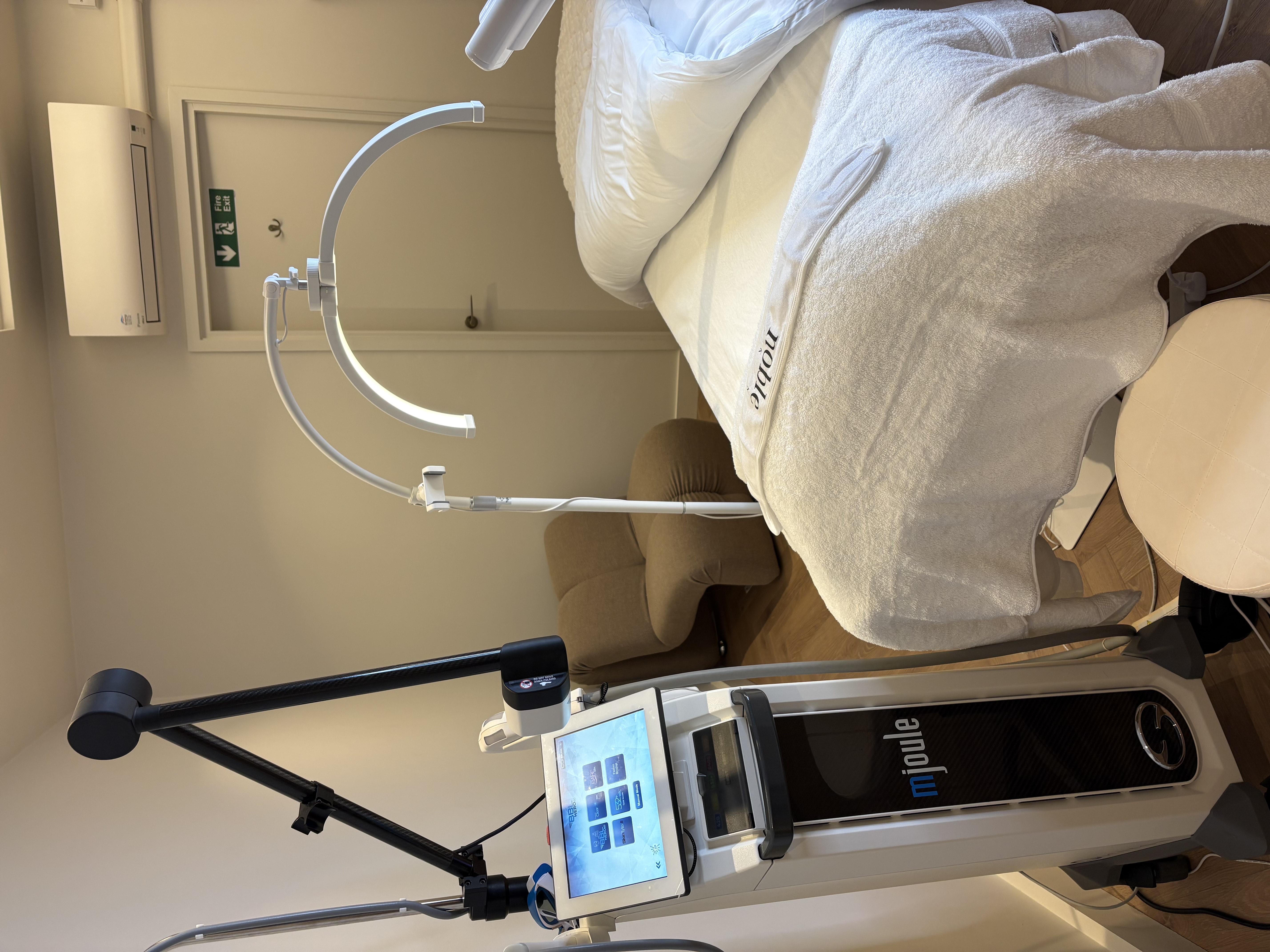 Rachel, personal trainer, looking to the side confidently in a fitness studio