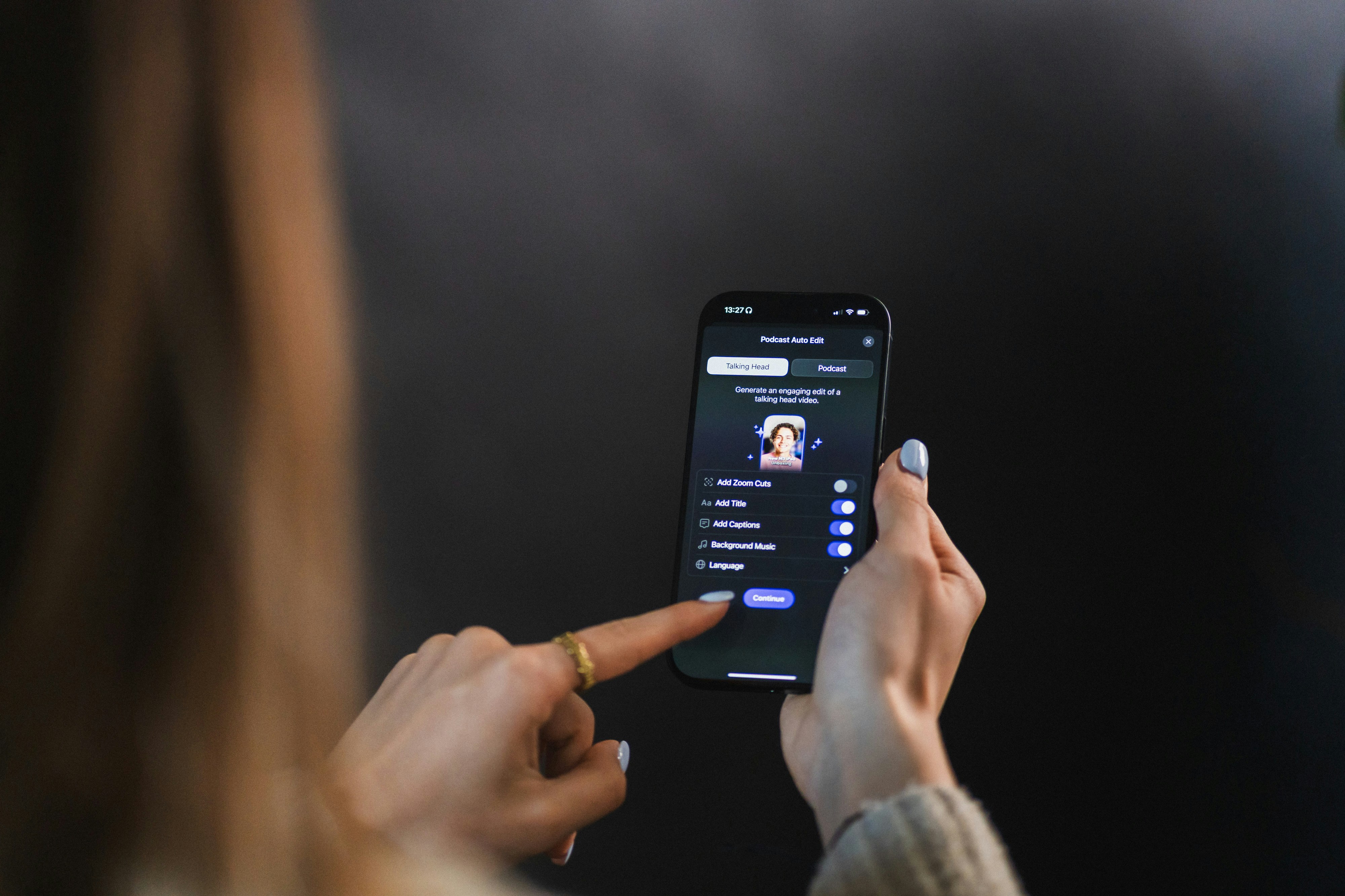 Woman's hand holding and touching smartphone screen of a smartphone