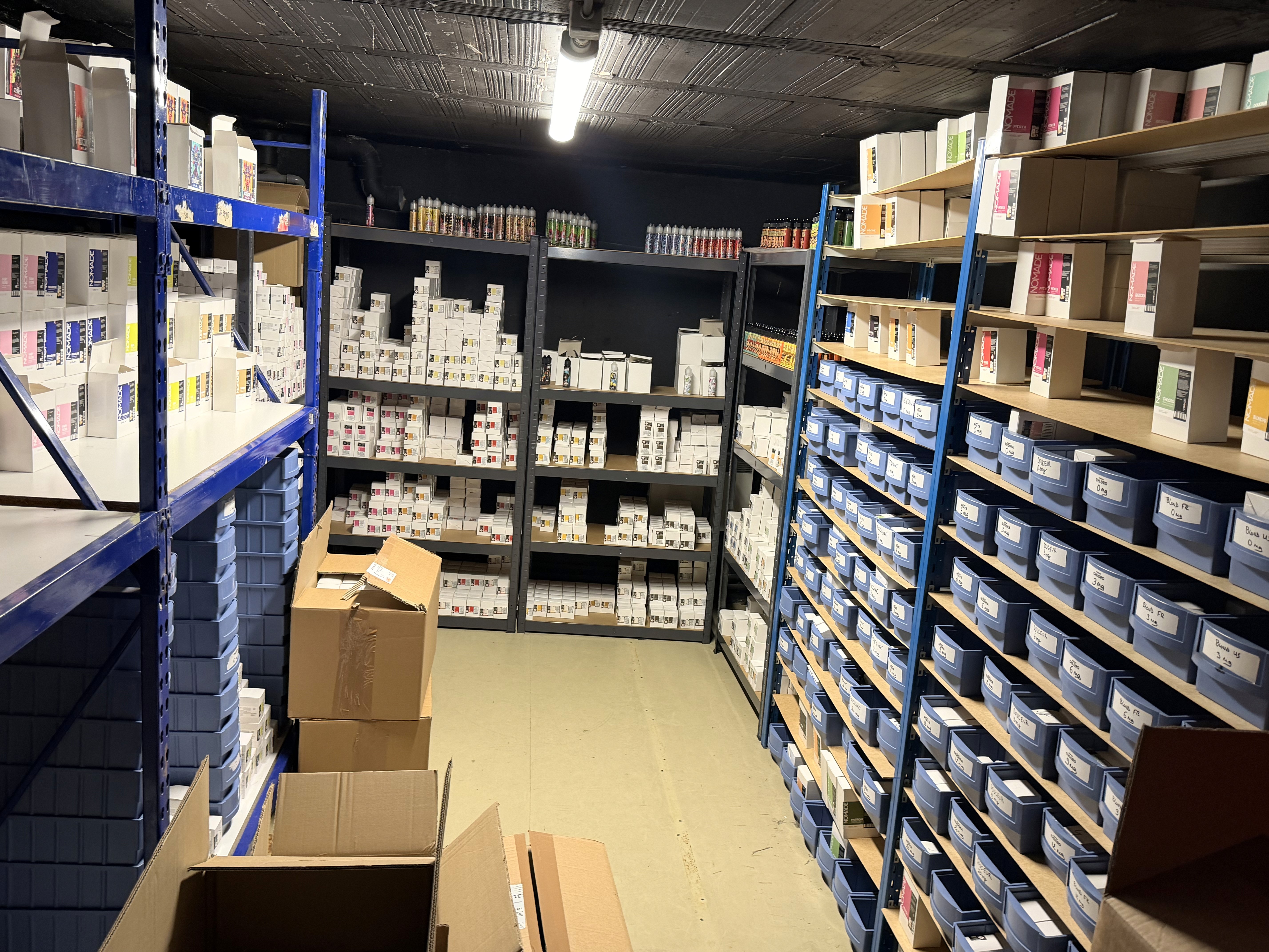 man smiling and using MacBook