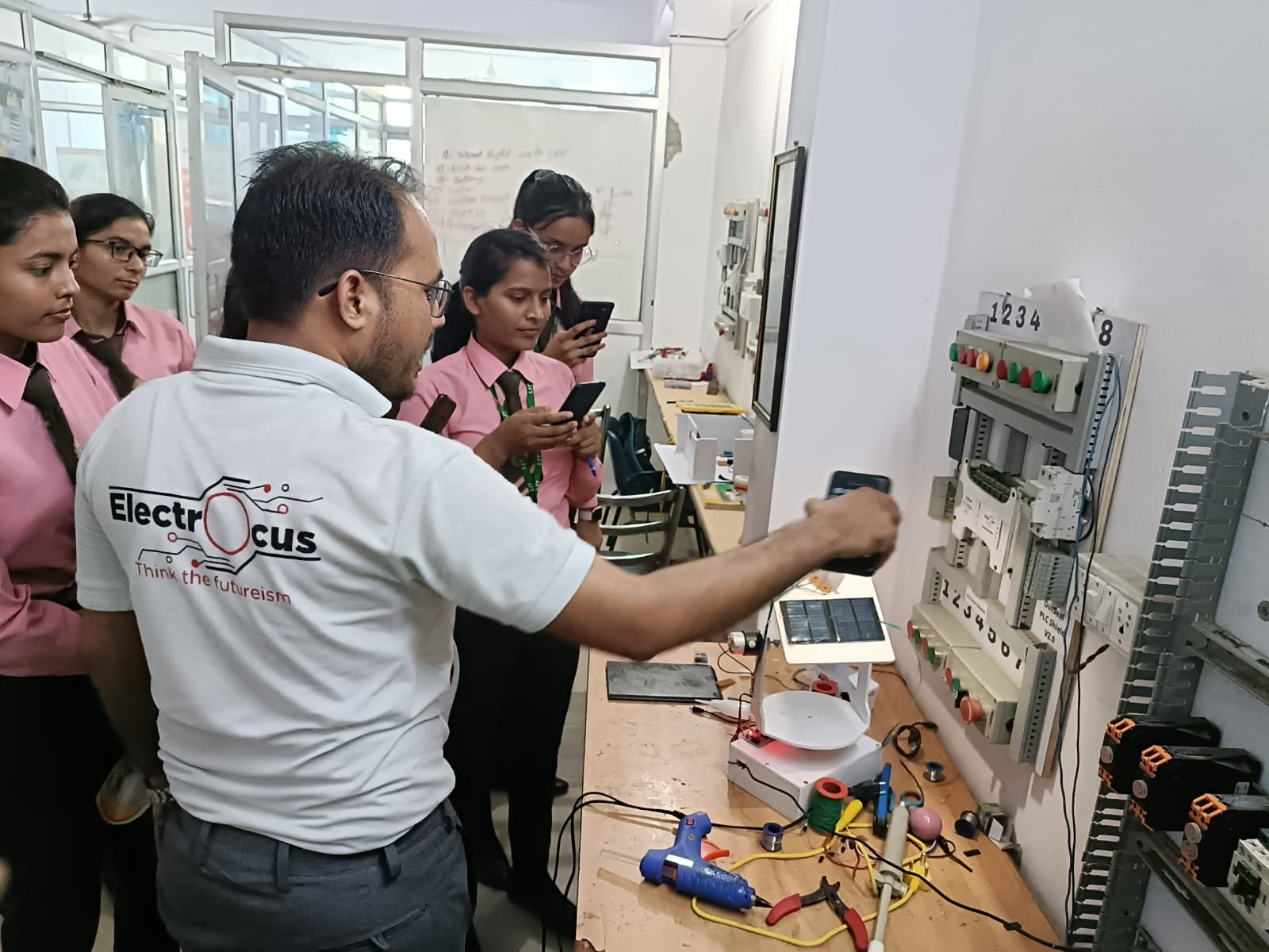 Full moon rising behind a house at night