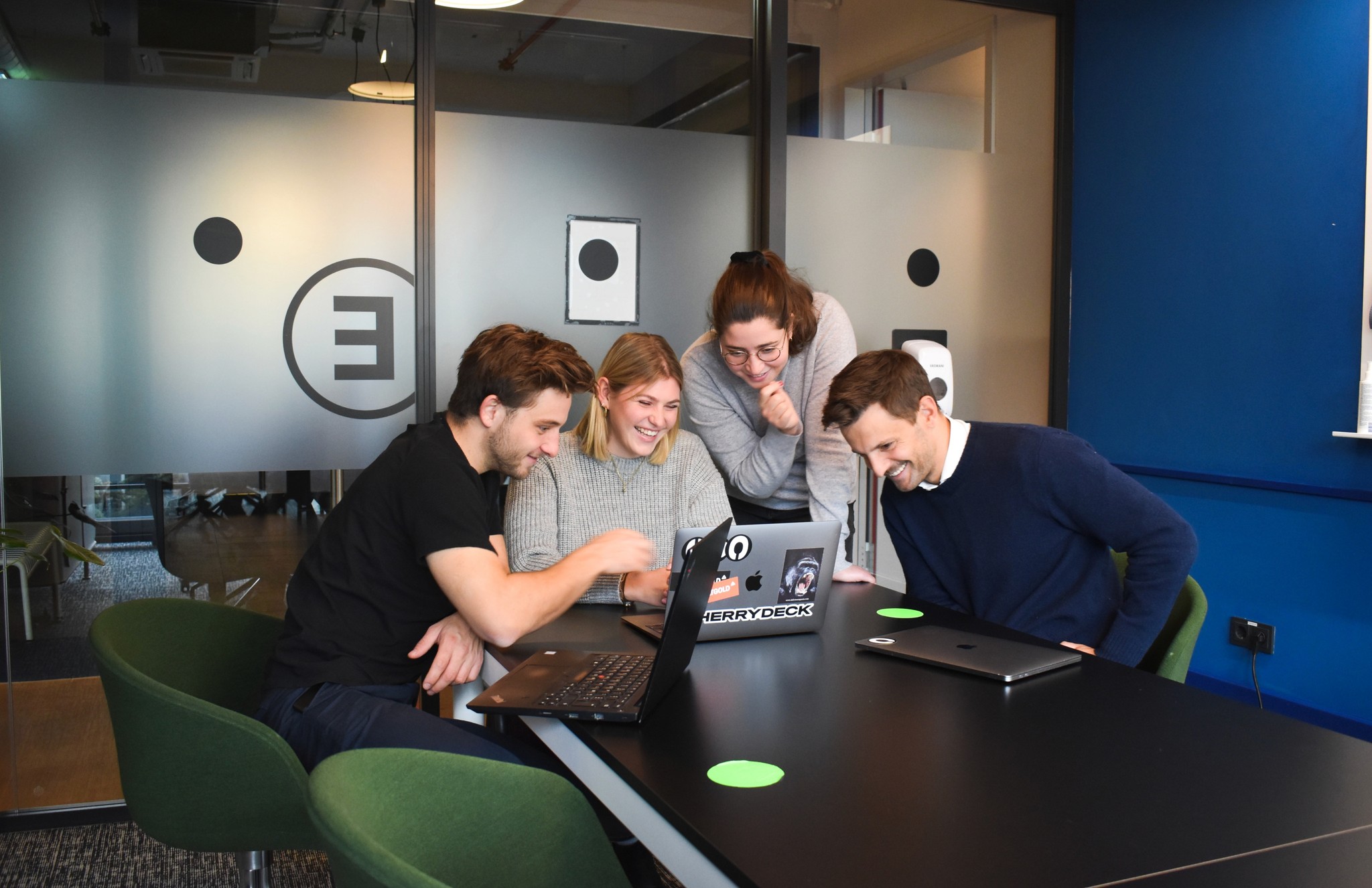 Man pointing to a computer screen with another man