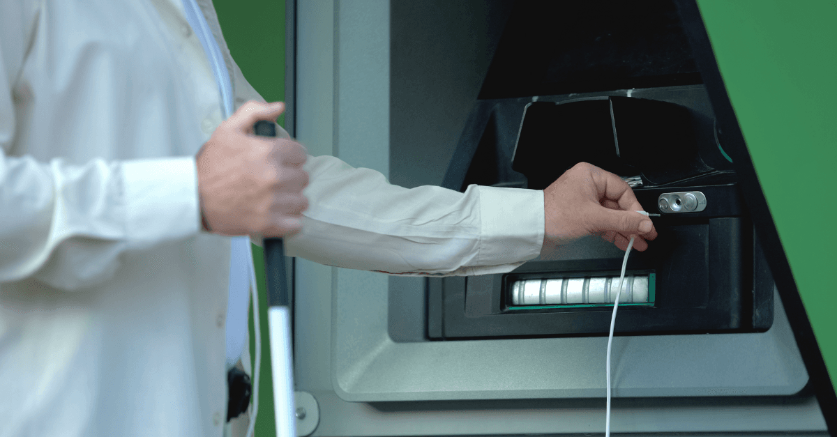 A self-service ATM operated by a visually impaired person with voice output. with voice output, all information is read out from the screen (text to speech) 