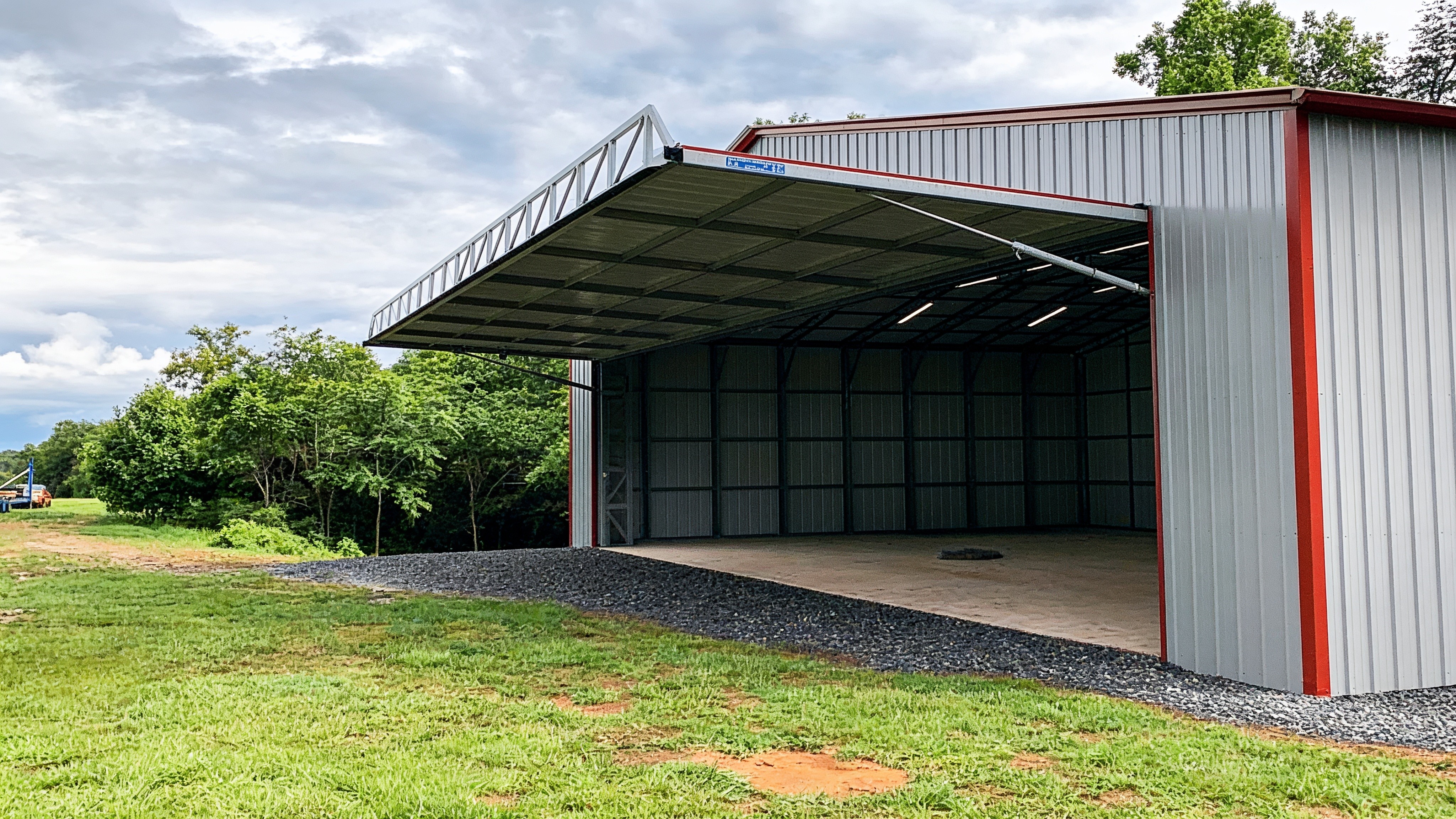 50-foot one-piece hydraulic shop door open on a metal workshop