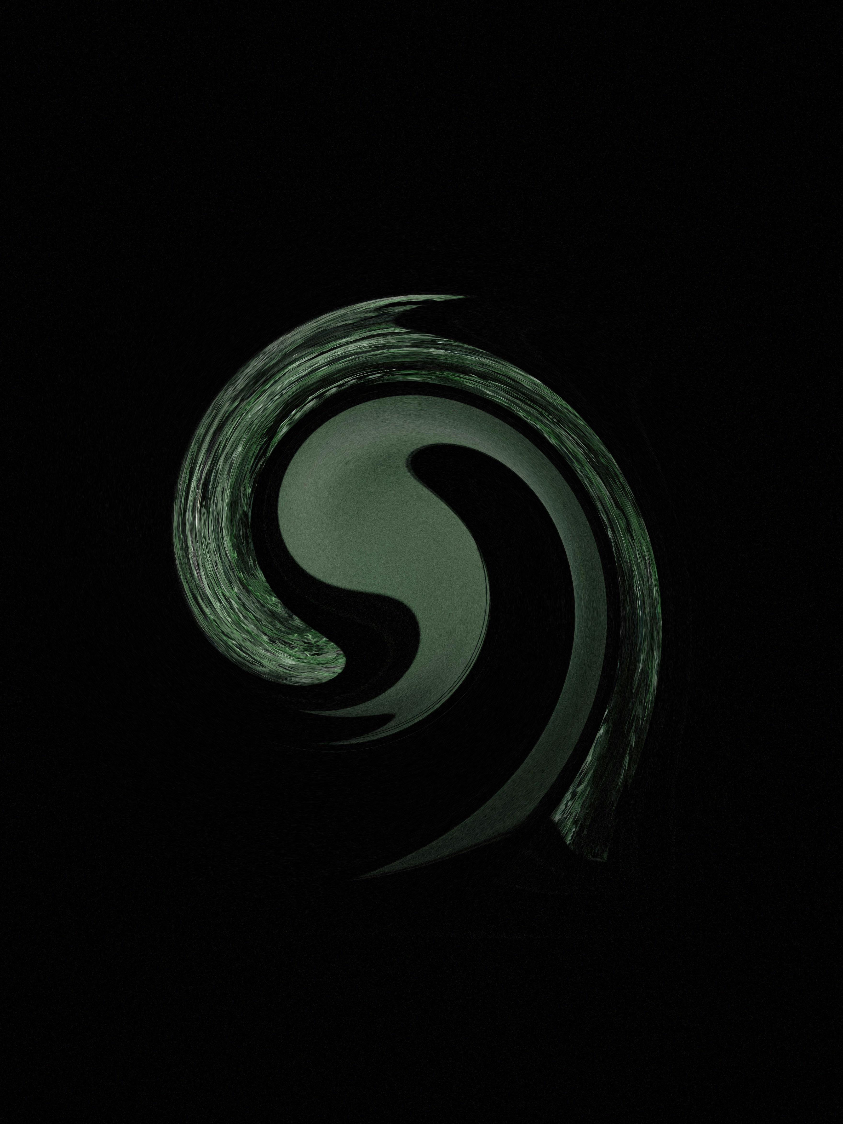 a black and white photo of a swirl in the dark