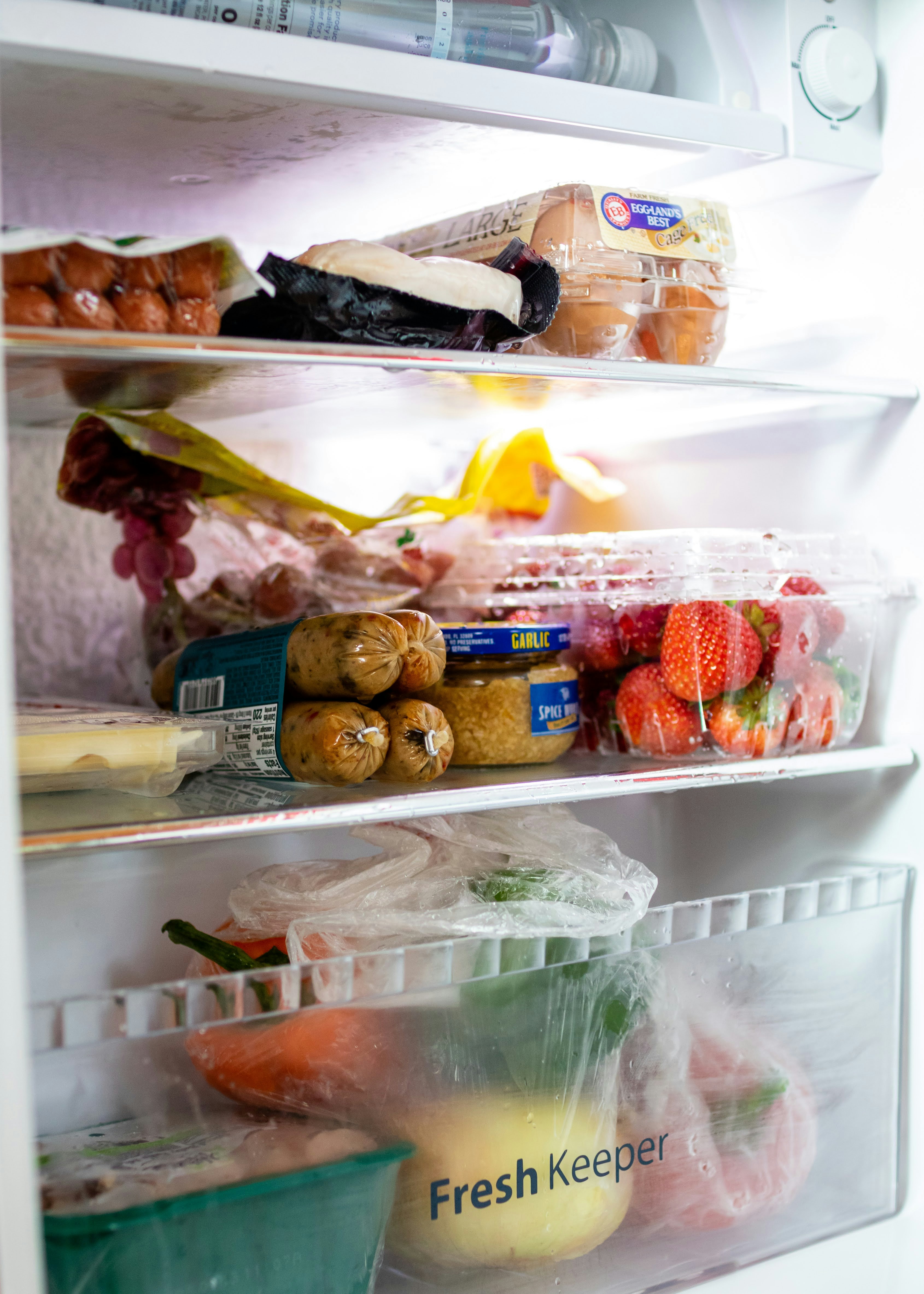 Open fridge stocked with everyday ingredients ready for AI meal planning