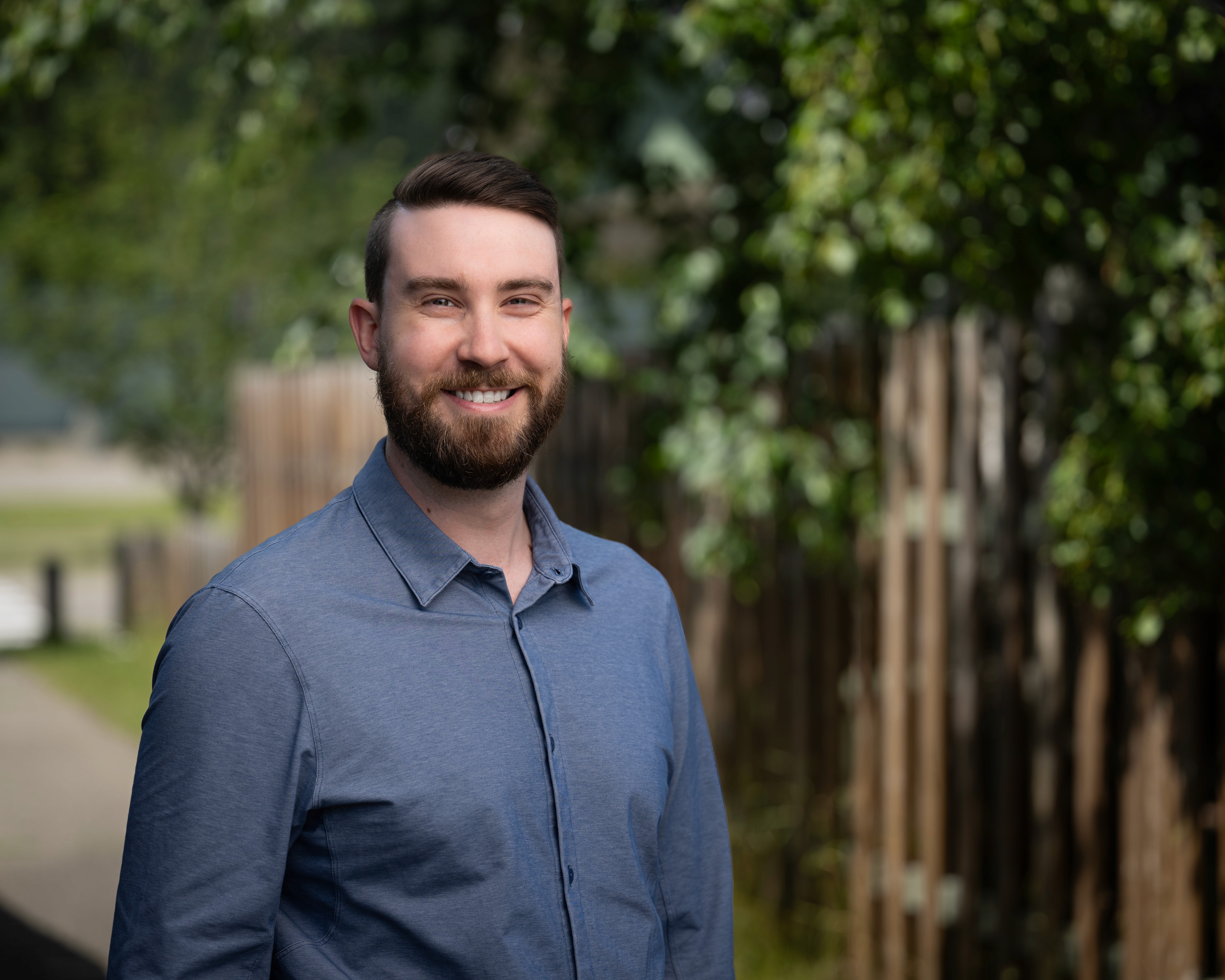 man in blue shirt smiling