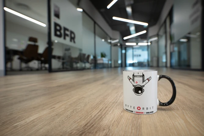Cup on the floor in a long hallway