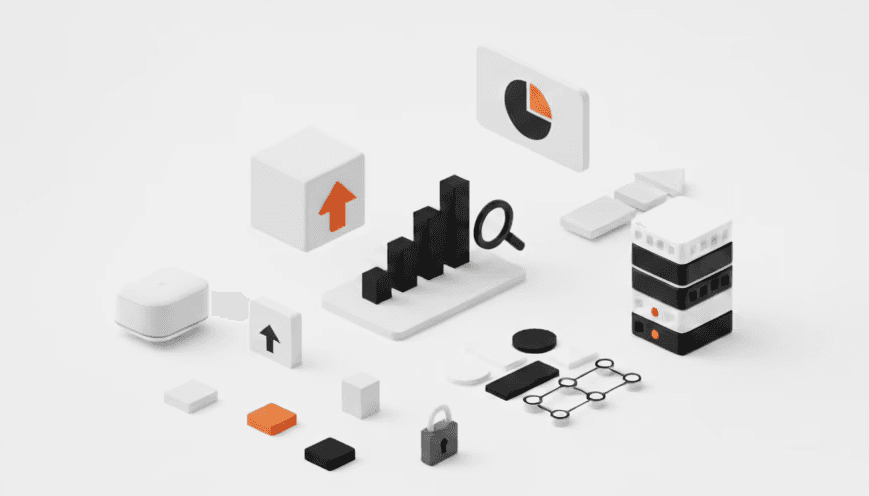 Two designers working at a modern desk arranging colour swatches, samples, and tech devices in a creative workspace.