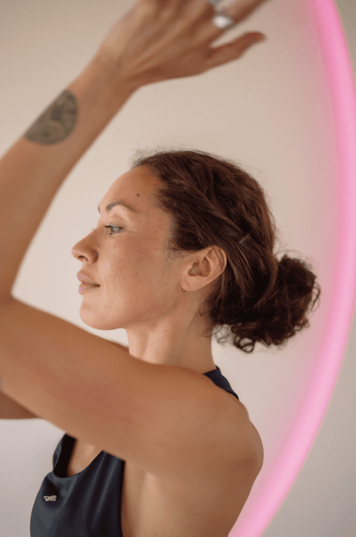 Black cosmetic product bottle against a dark background