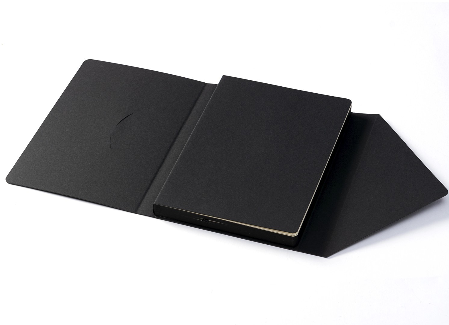 Open view showing the black outer sleeve separated from the notebook insert.