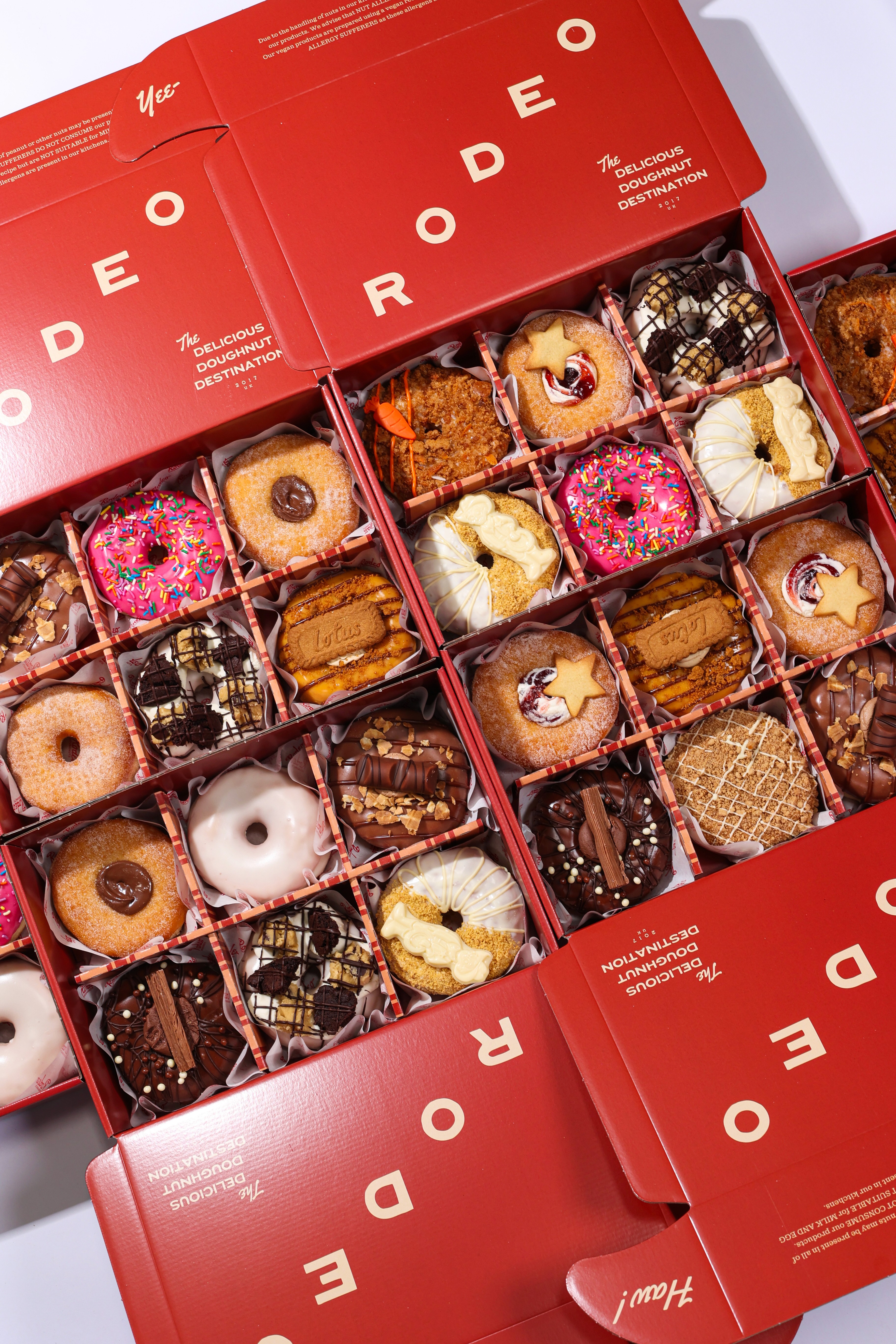 Top down shot of multiple boxes of doughnuts