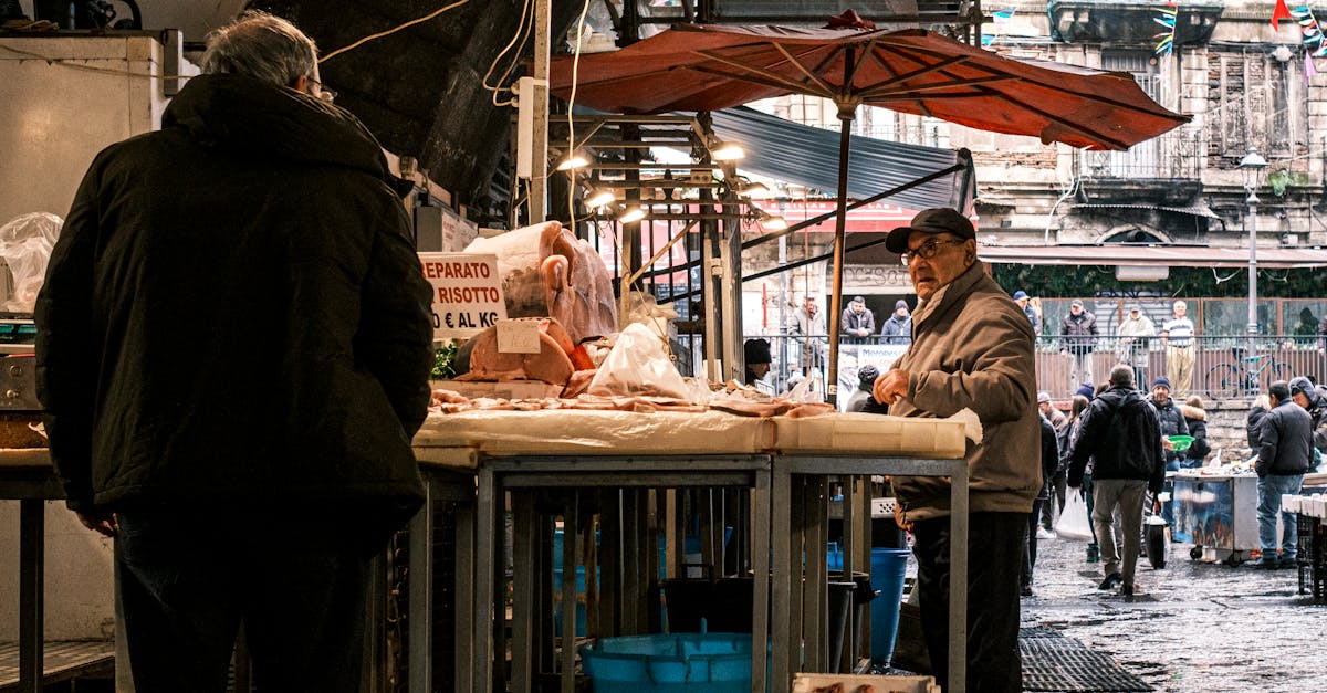 Explore the vibrant atmosphere of a bustling fish market in Catania, Sicily, showcasing local vendor