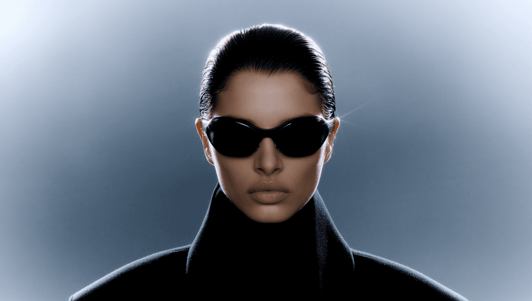 Elegant close-up portrait of young woman with dark hair wearing black sunglasses and black turtleneck, neutral gray background, high-fashion studio lighting, professional model headshot in photo editing interface.