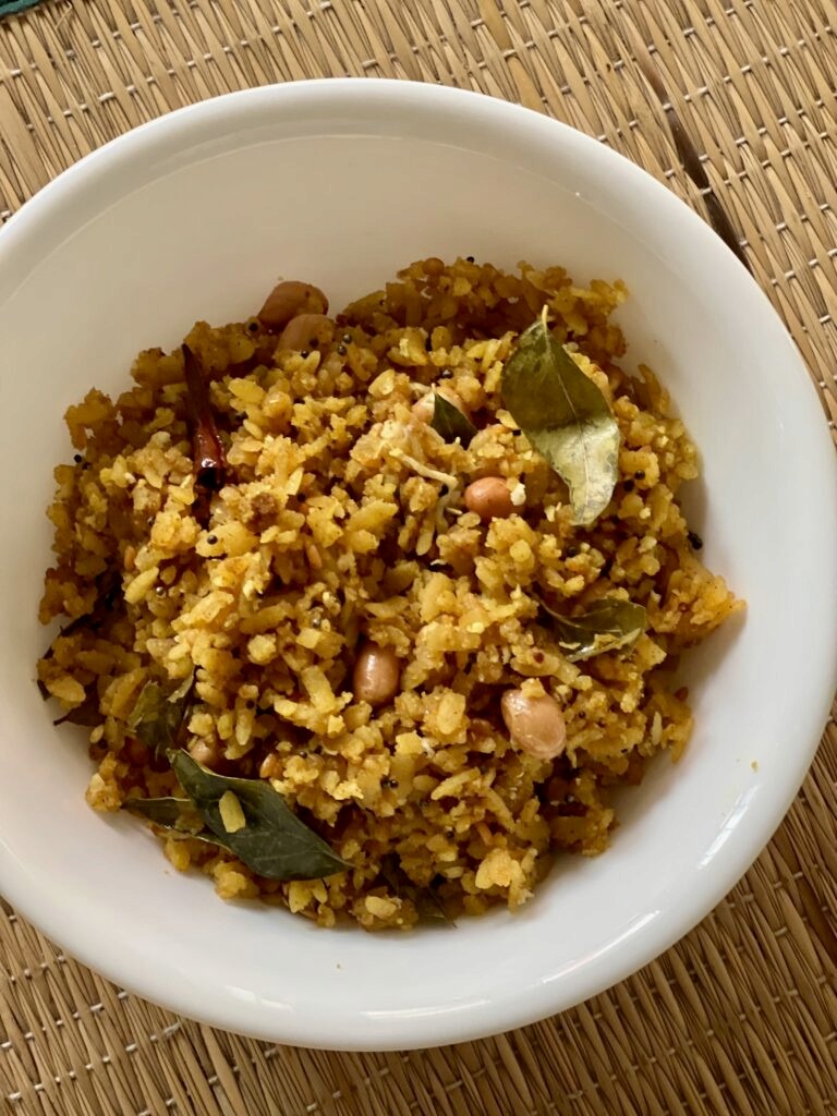Huli avalakki or gojju avalakki served in a bowl.