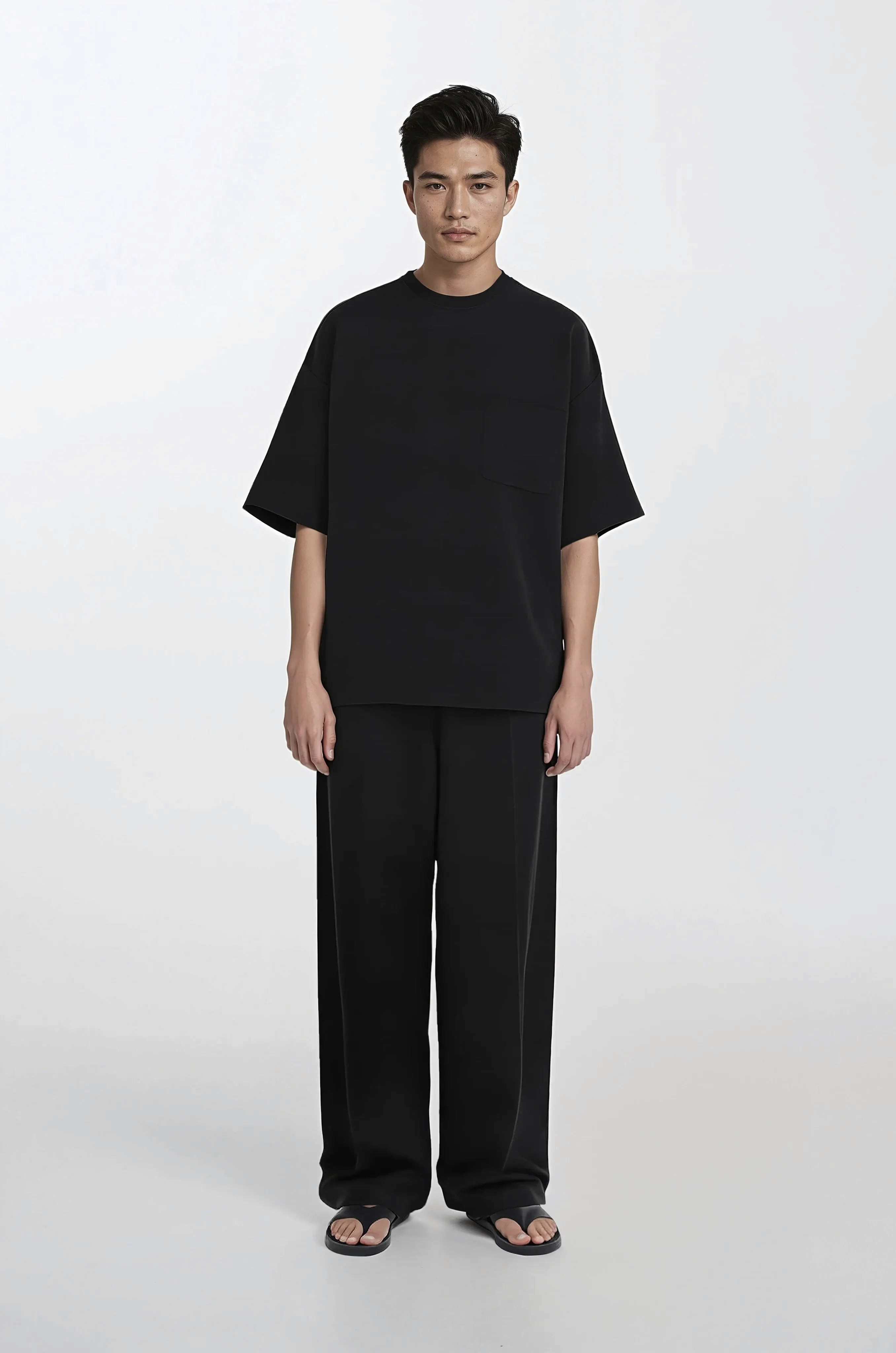 A guy wearing a black shirt over a white background
