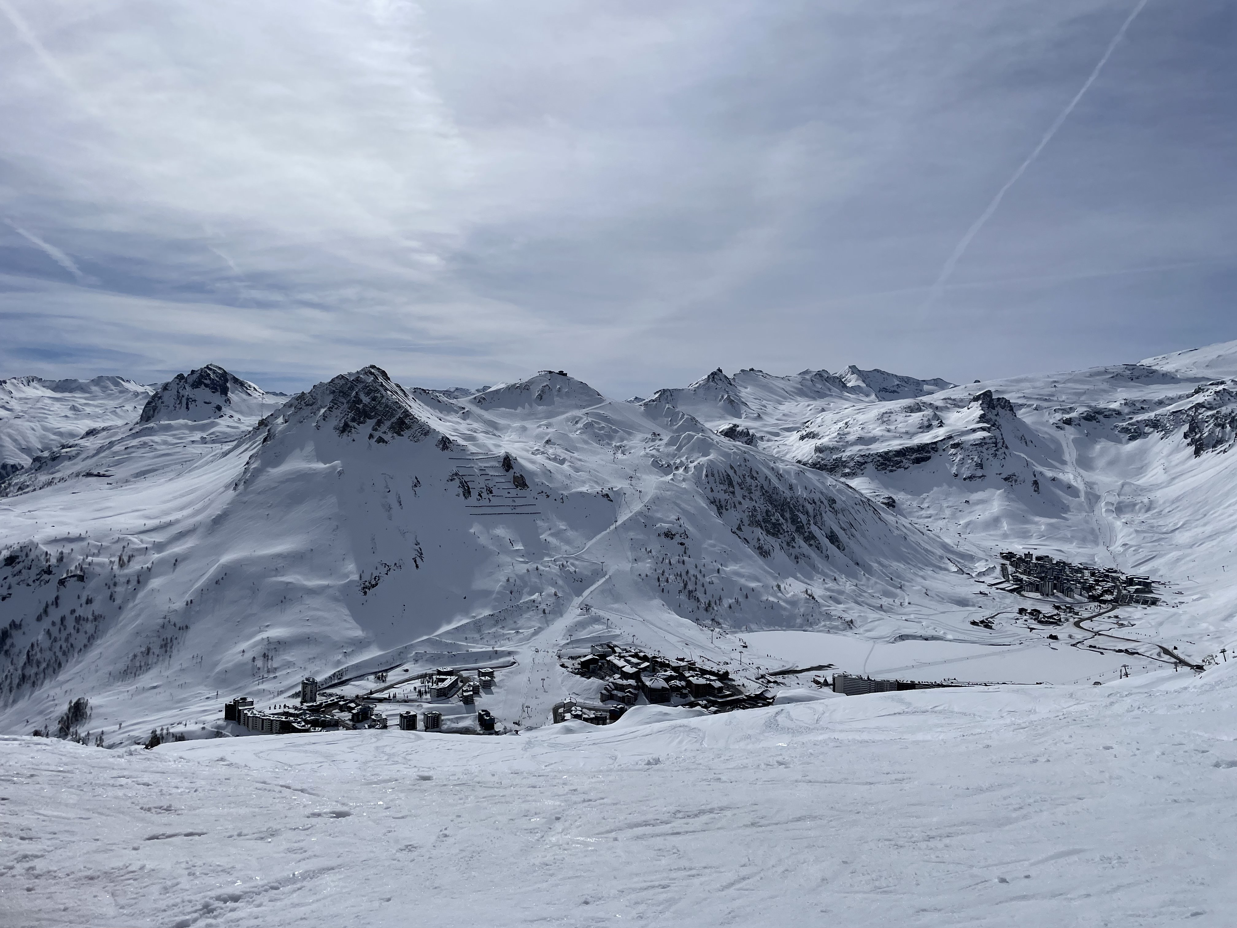 kids lying on a glass land and smiling