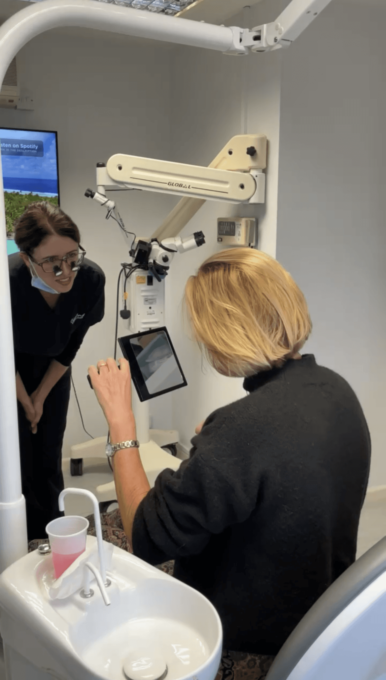 Dr April speaking to a patient about their teeth.
