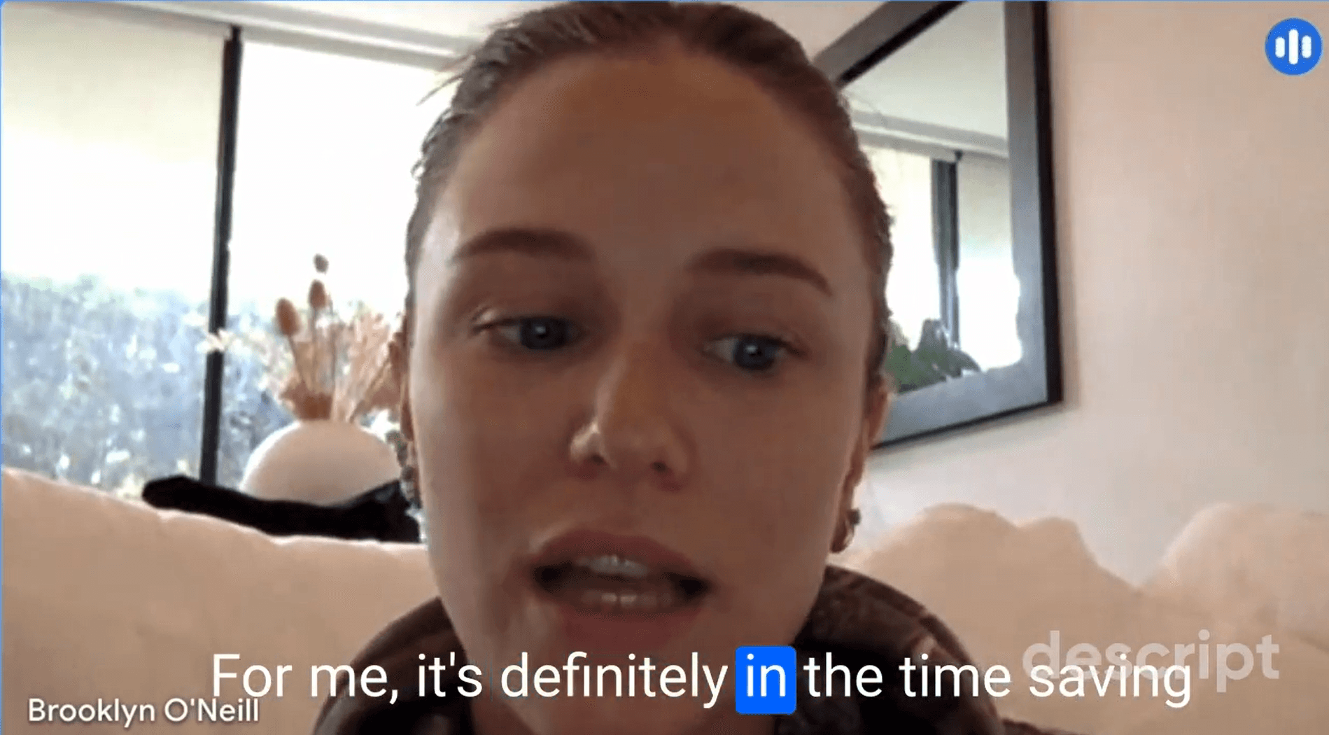 Close-up of lush, dark green leaves, some glossy and wet, against a muted background.