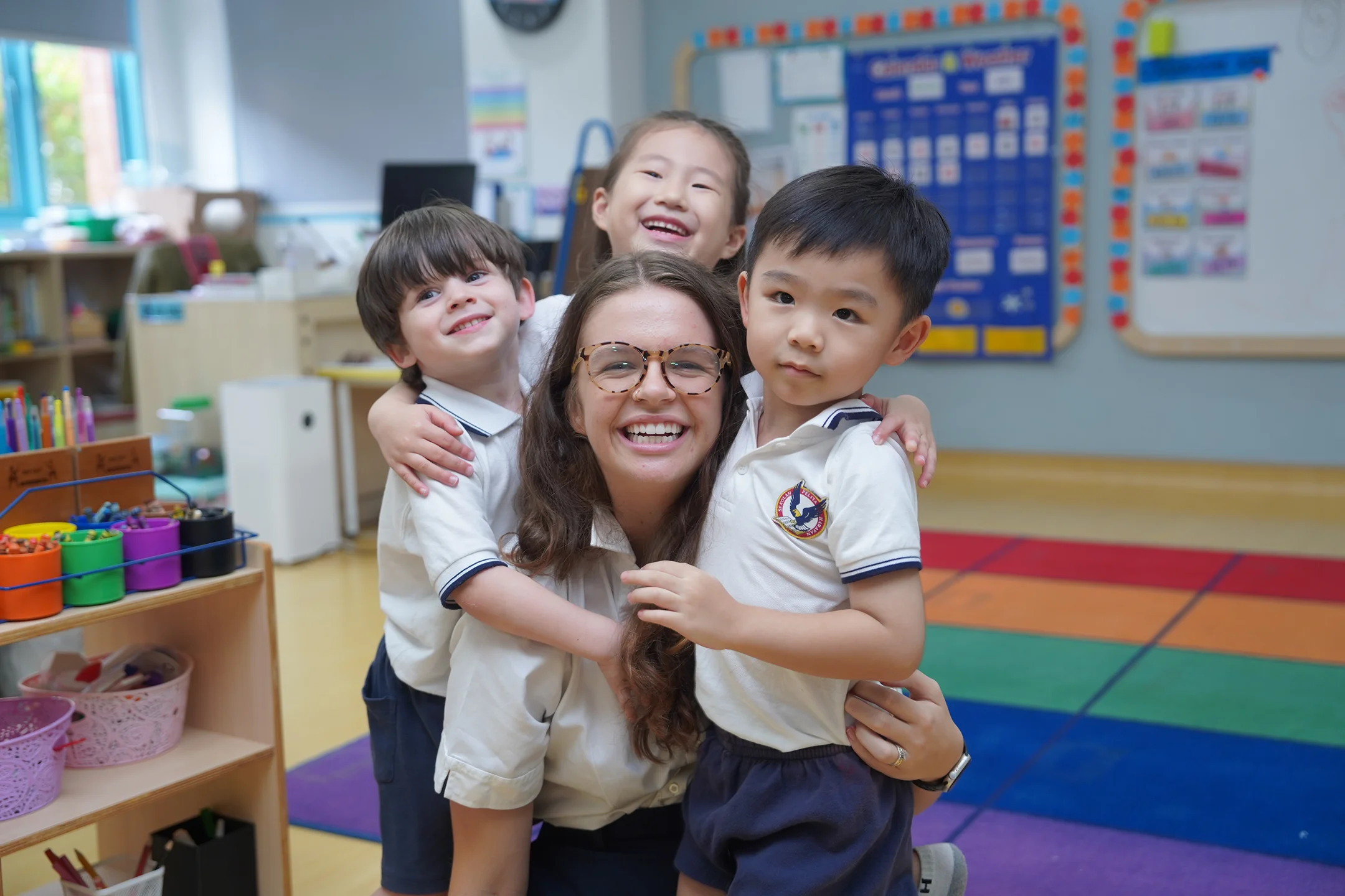girl in pink long sleeve shirt writing on white paper