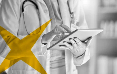 Healthcare professional using a tablet, representing AI strategy acceleration and digital health transformation