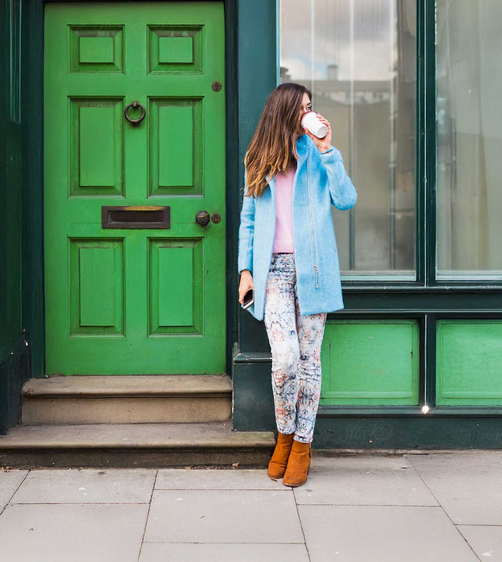 lady checking her phone and smiling