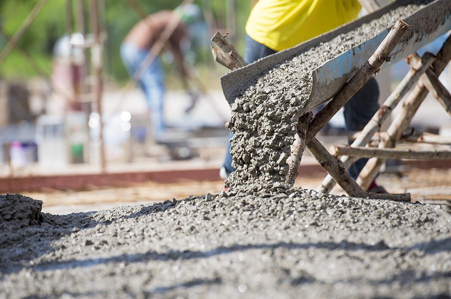 Commercial concrete contractors pouring a slab for a large commercial site